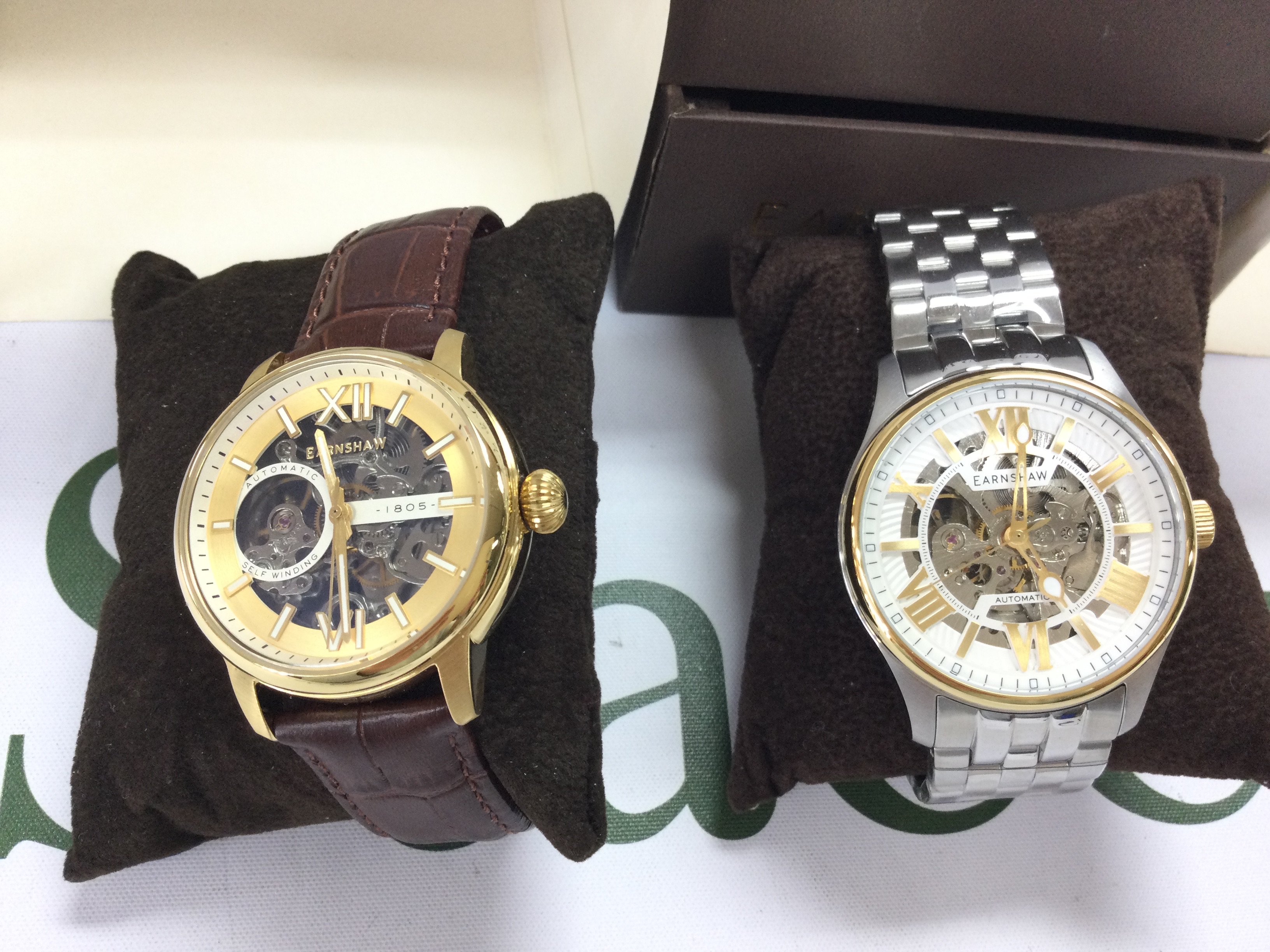 Two Earnshaw gents automatic watches both in excellent condition and seen running. Both with boxes (note one box damaged). Postage B