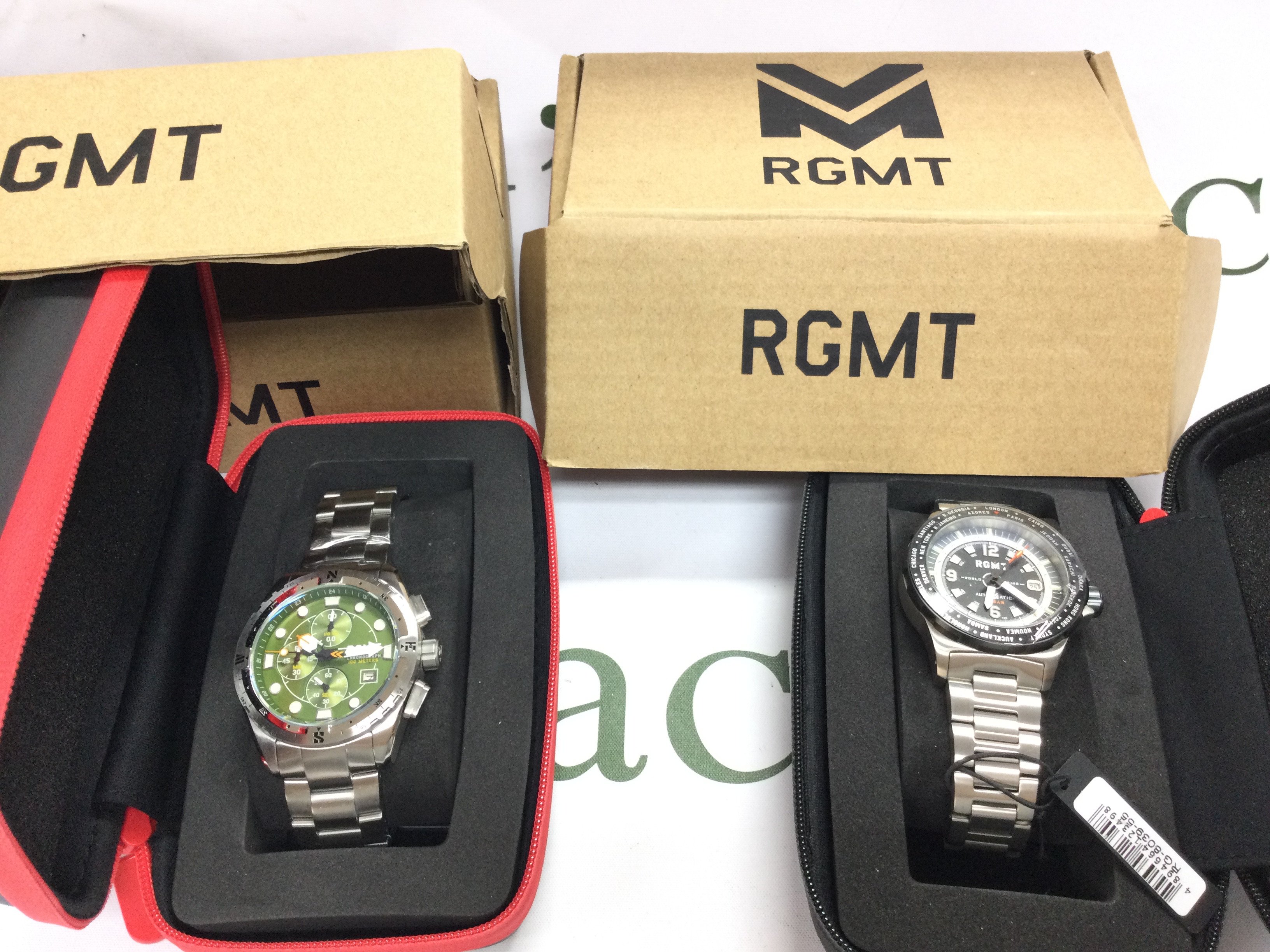 Two RGMT wrist watches in unworn condition. Not seen running. Postage B