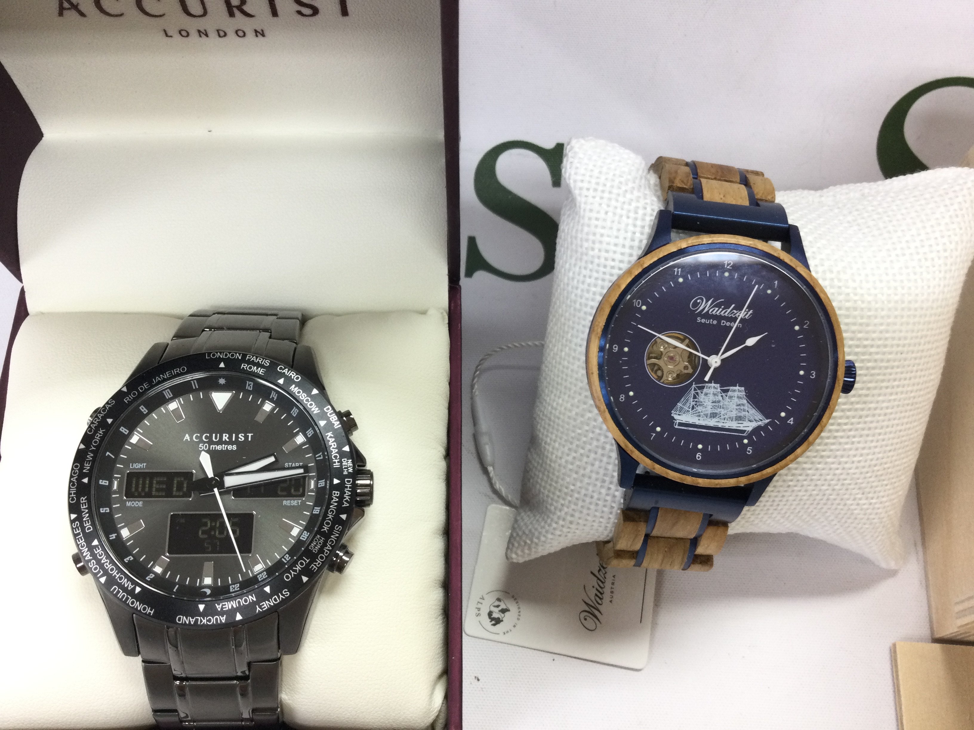 Two gents watches including a Accurist and a Waidzeit wooden strap. Both seen running. Postage B