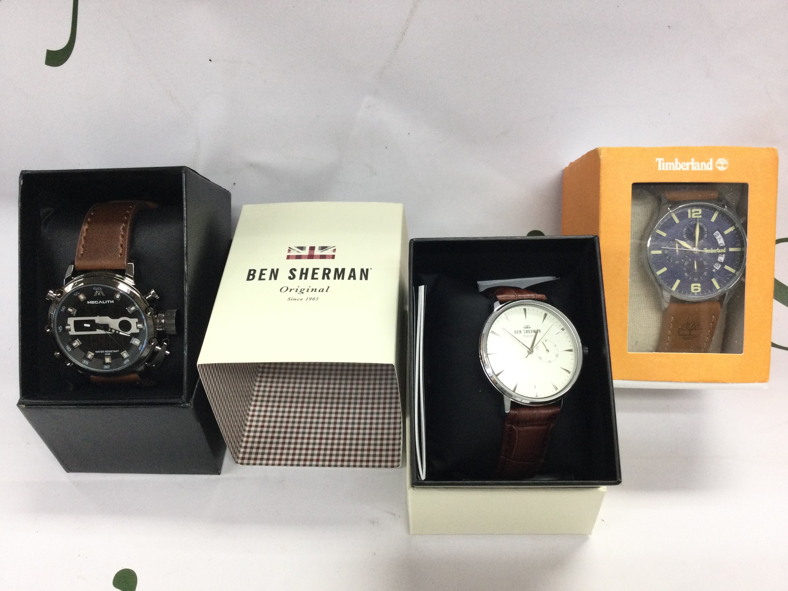 Three fashion watches including timberland and Ben Sherman etc. All in boxes. Postage B