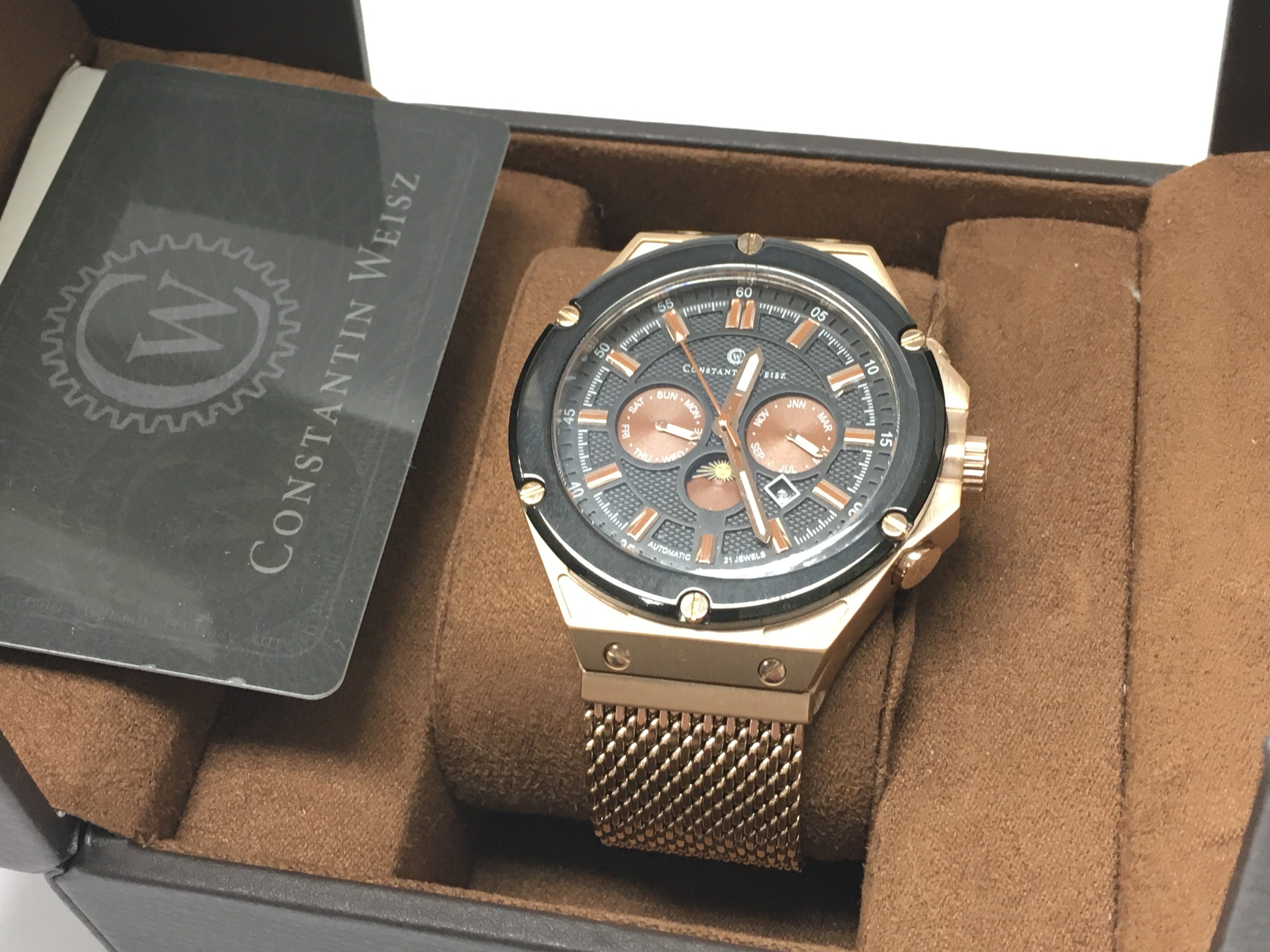 A mens gold tone Constantin Weisz automatic moon phase calendar watch, model 19s007CW-50mm case, complete with box and paperwork. Postage category B