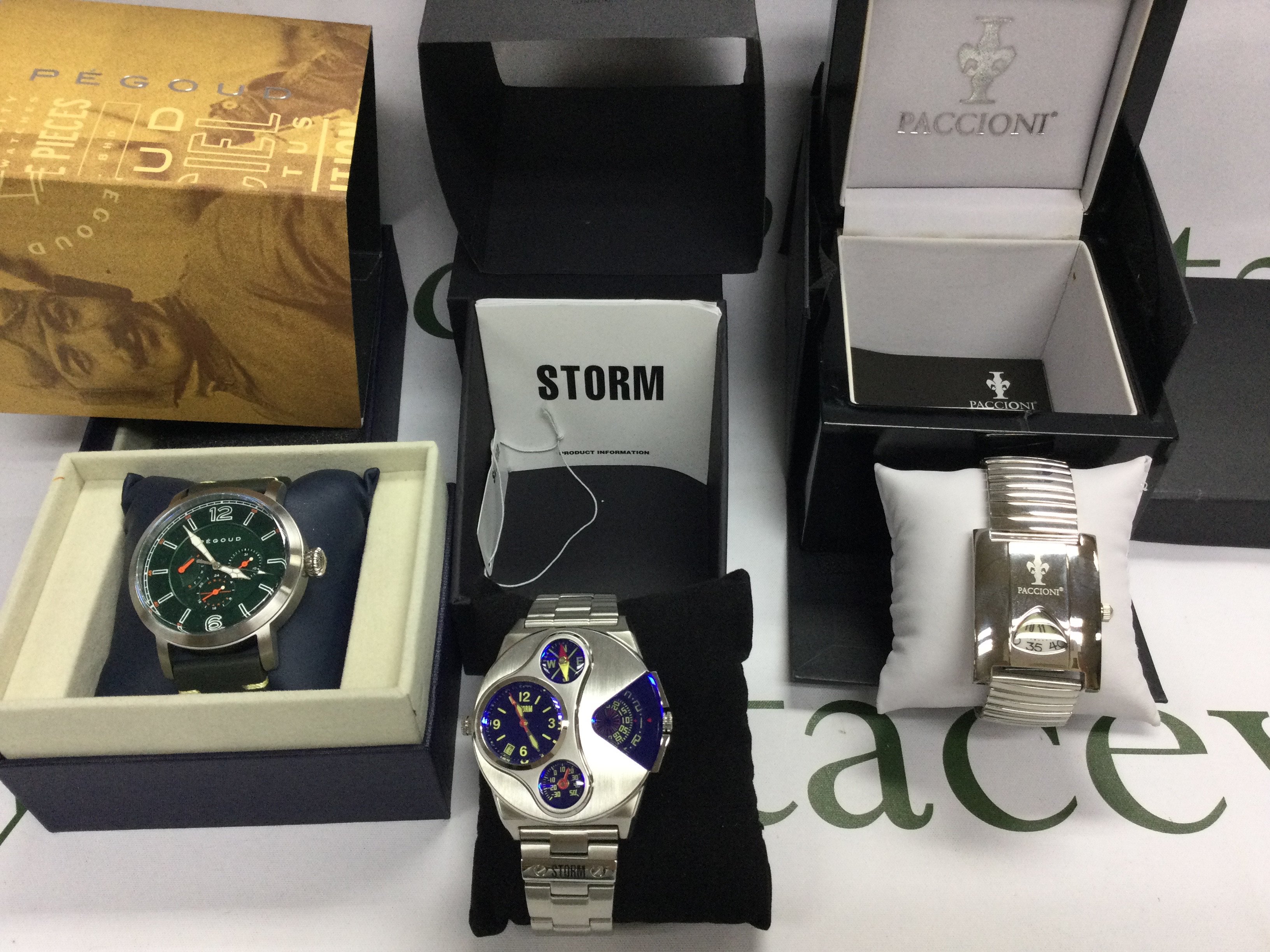 Three gents watches including Storm and Pacconi etc. All with boxes and paperwork. Postage B