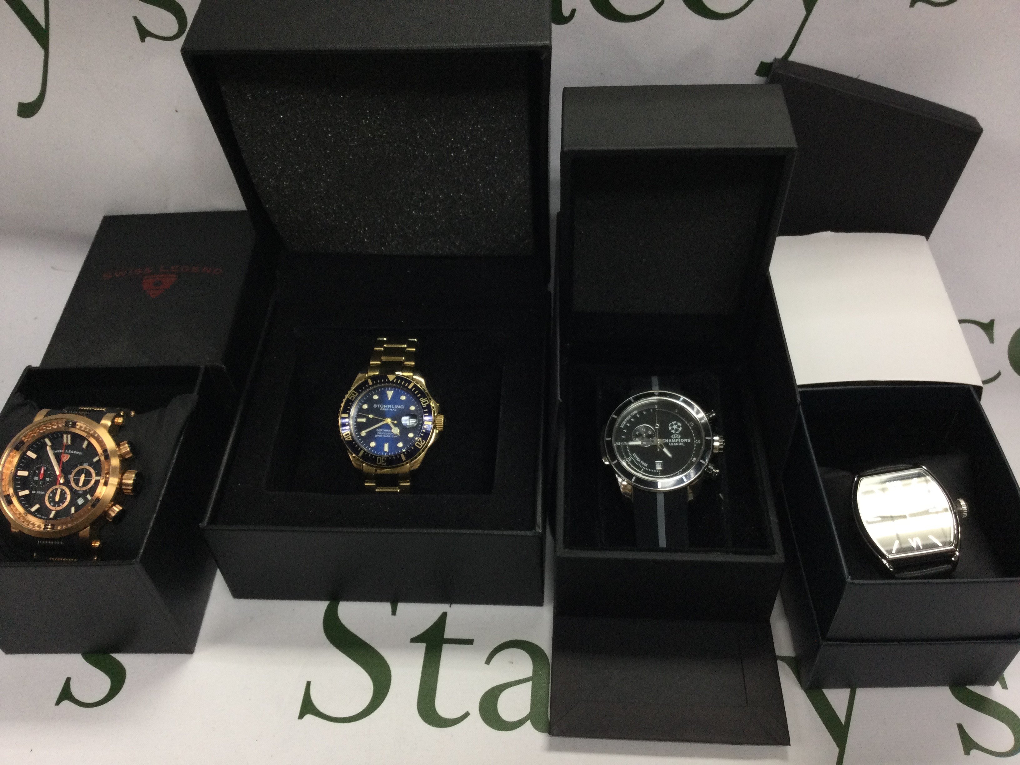 Small collection of watches in their original boxes. Including Swiss legend and Ben Sherman etc. Postage B