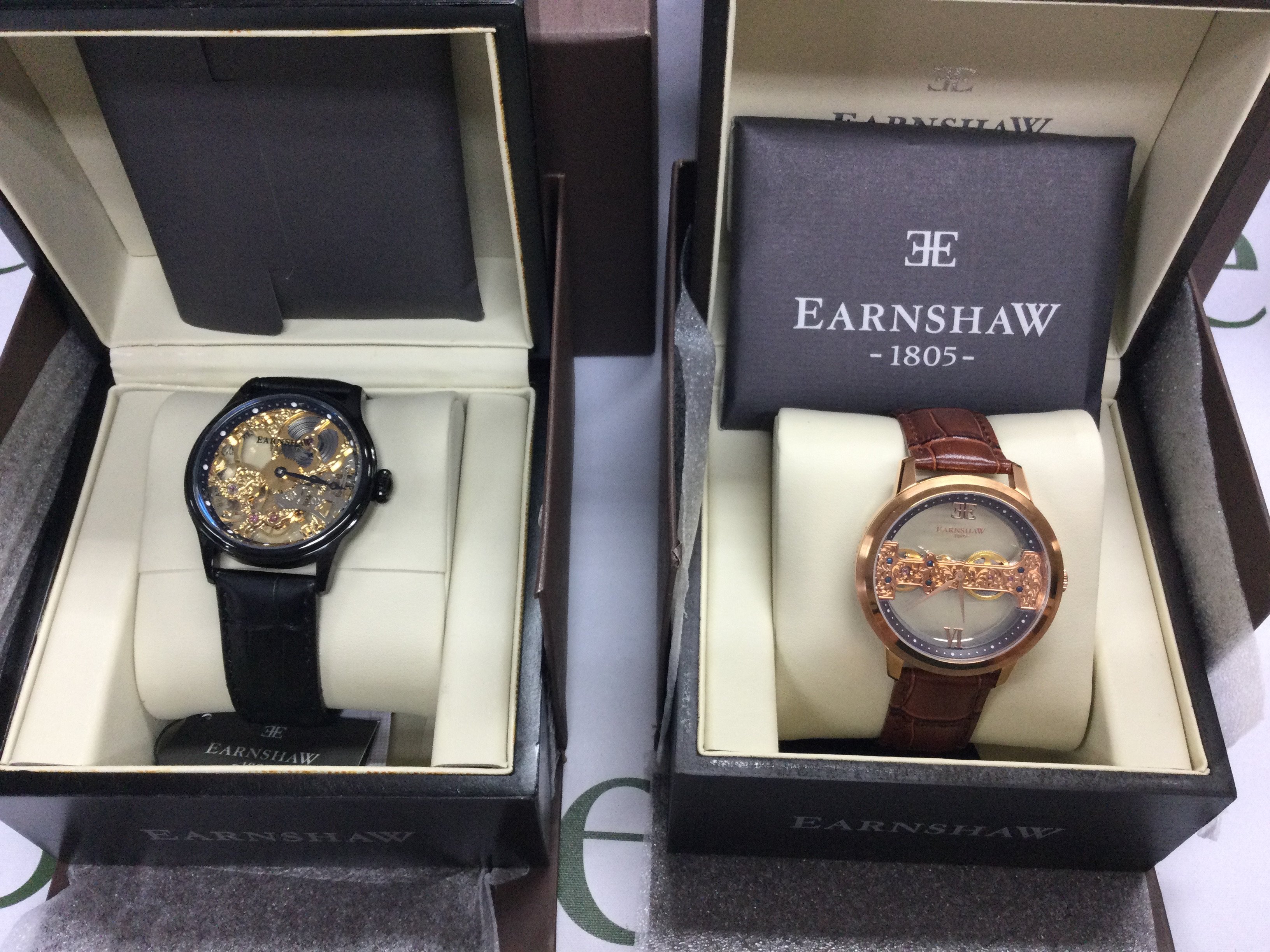 Two Earnshaw manual wind wrist watches with skeleton dials including boxes both seen running. Postage B