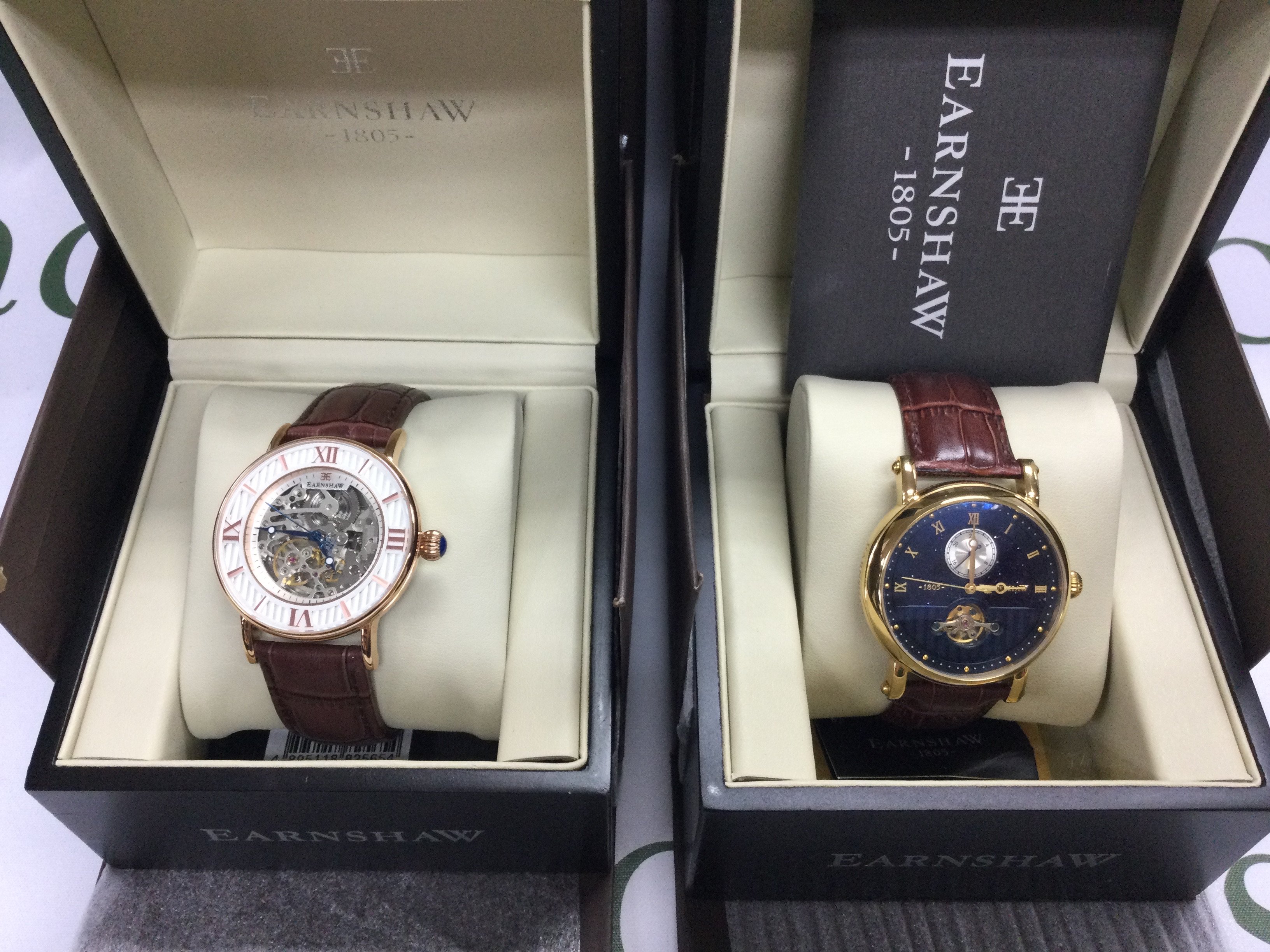 Two Earnshaw automatic wrist watches including boxes both seen running. Postage B