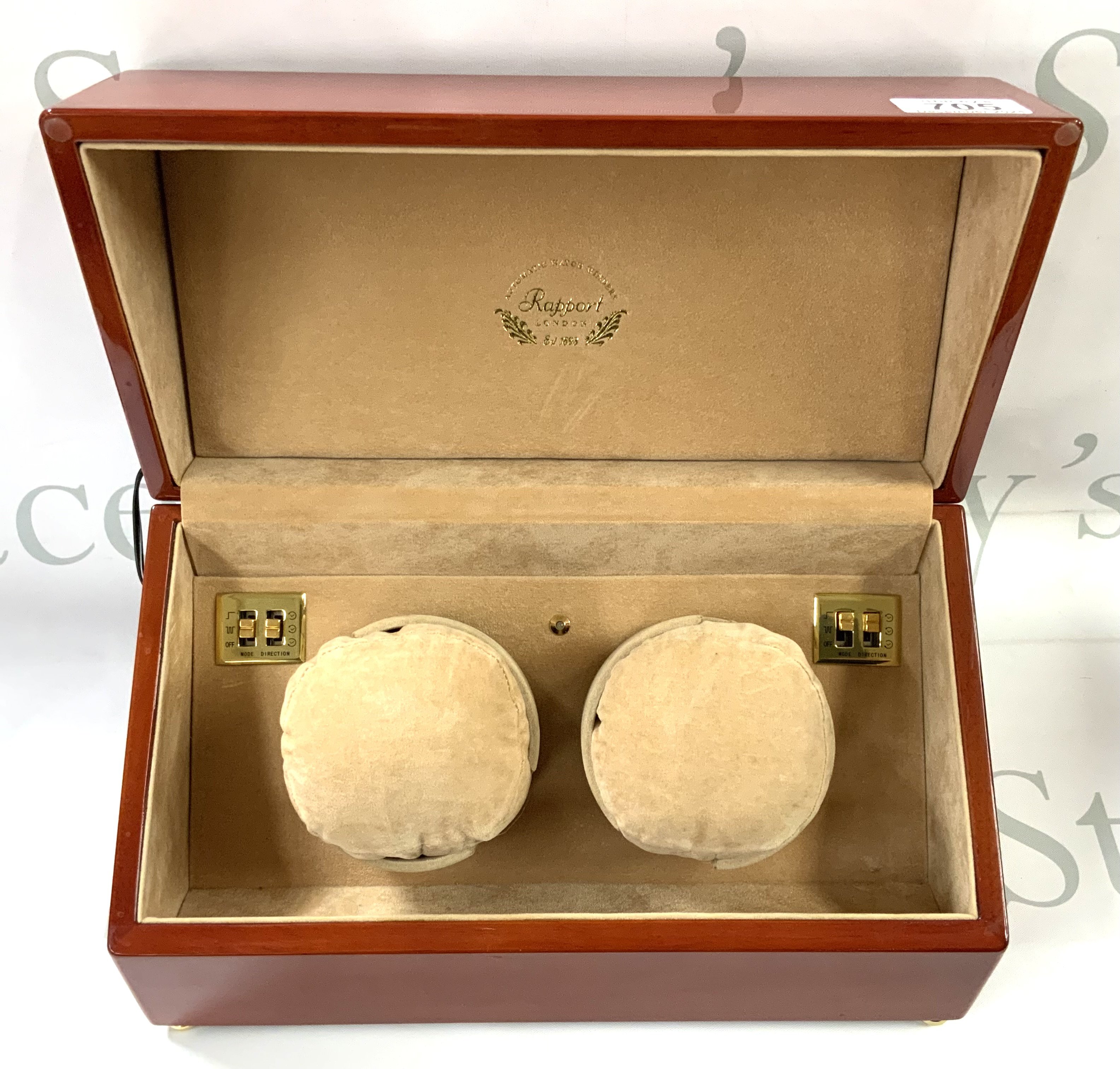 A double automatic watch winding box (1 side faulty). (D)