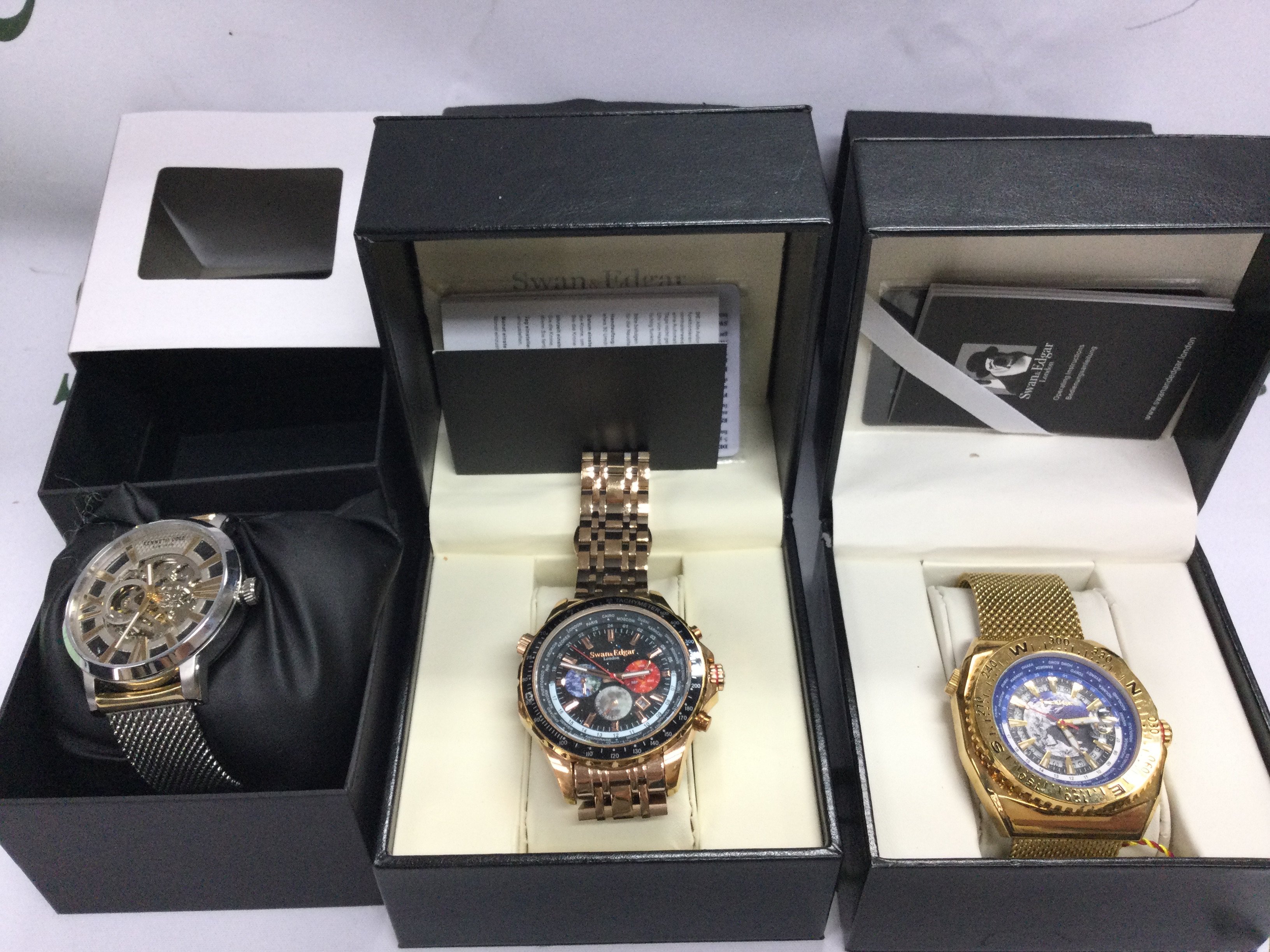 Two Swan and Edgar watches with boxes and paperwork seen running and a Kenneth Cole watch. Postage B