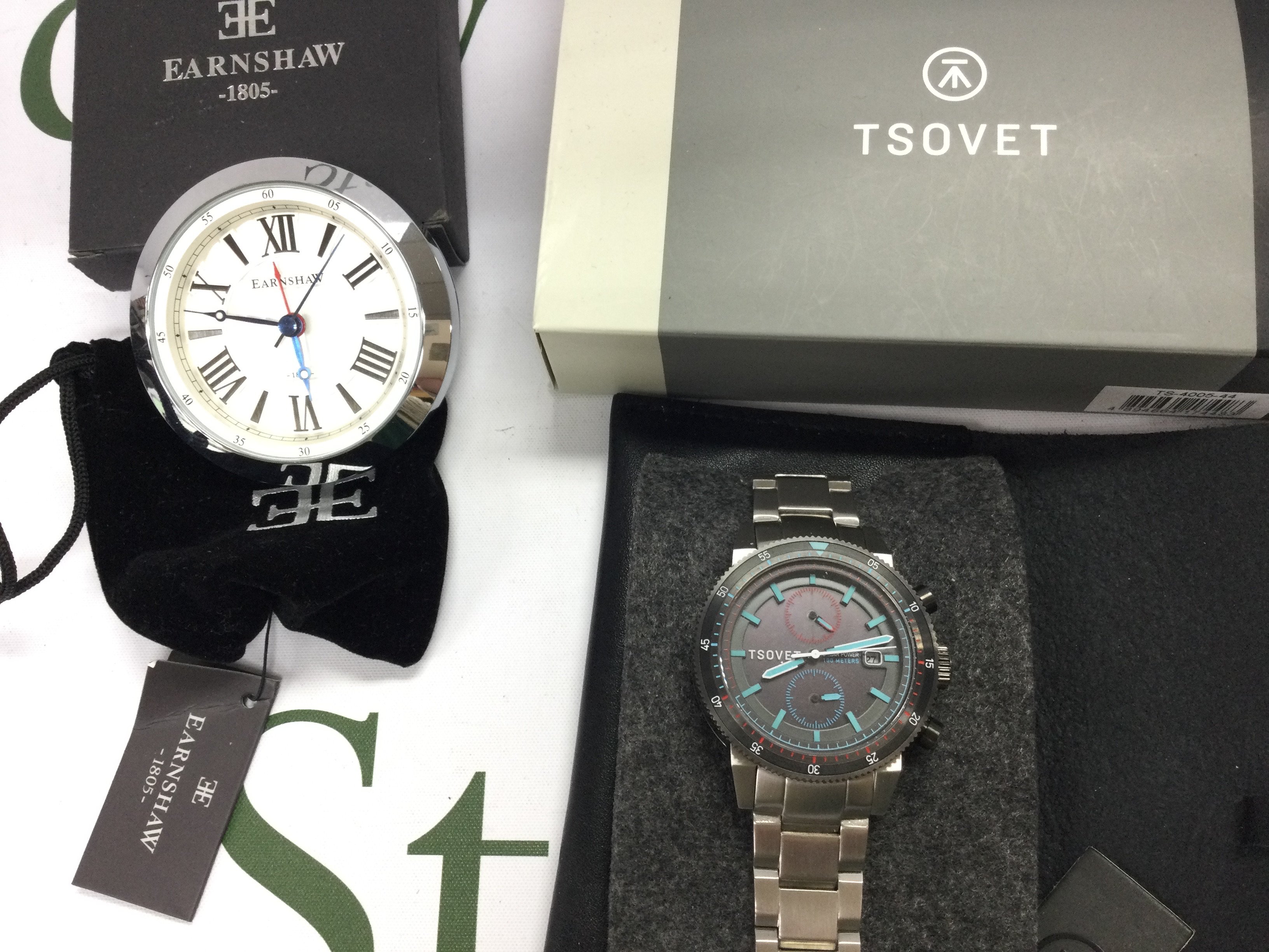 A Tsovet gents watch and a Earnshaw desk clock. Postage B