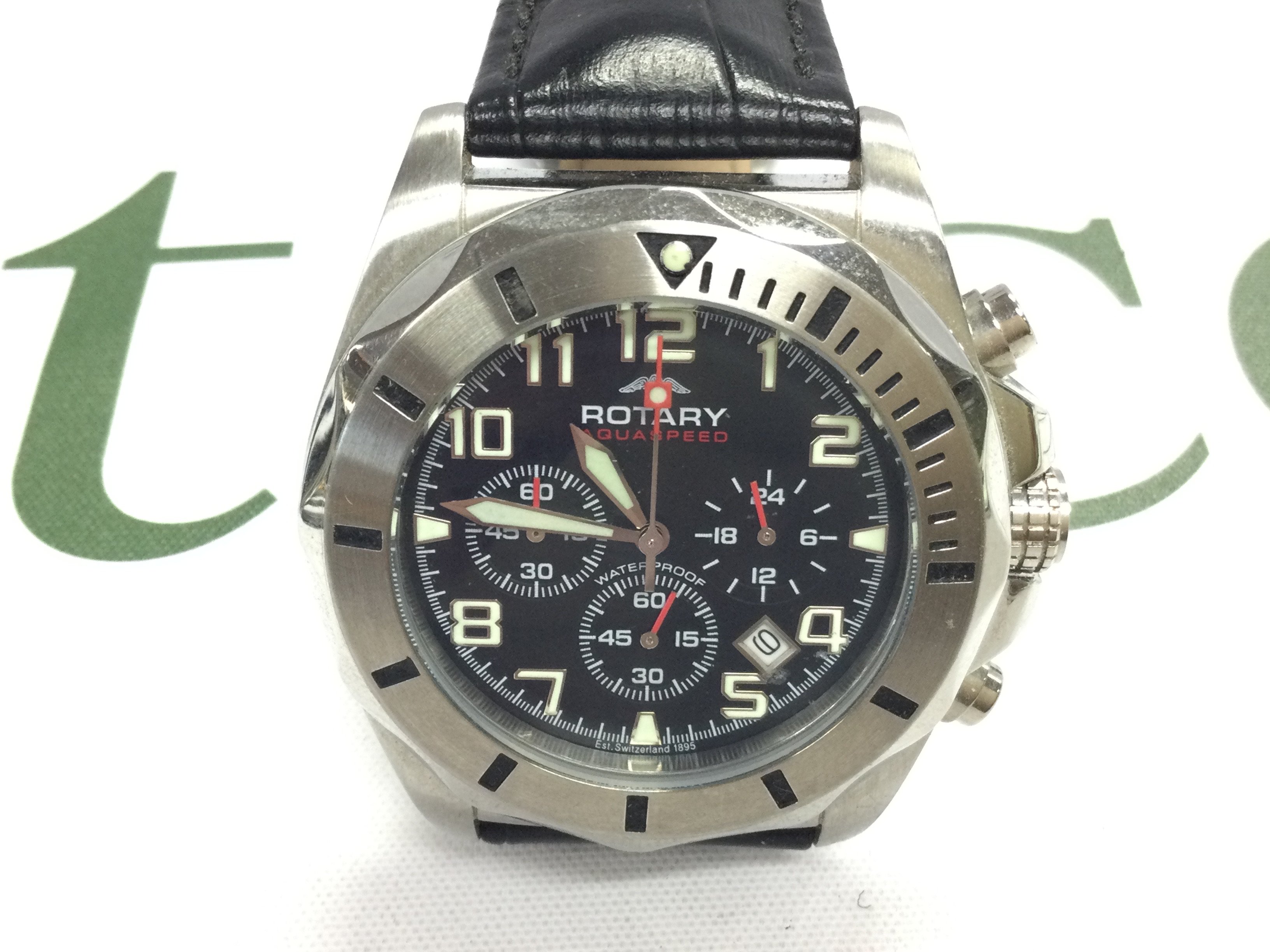 A Rotary quartz Chronograph watch on black leather strap. Postage B