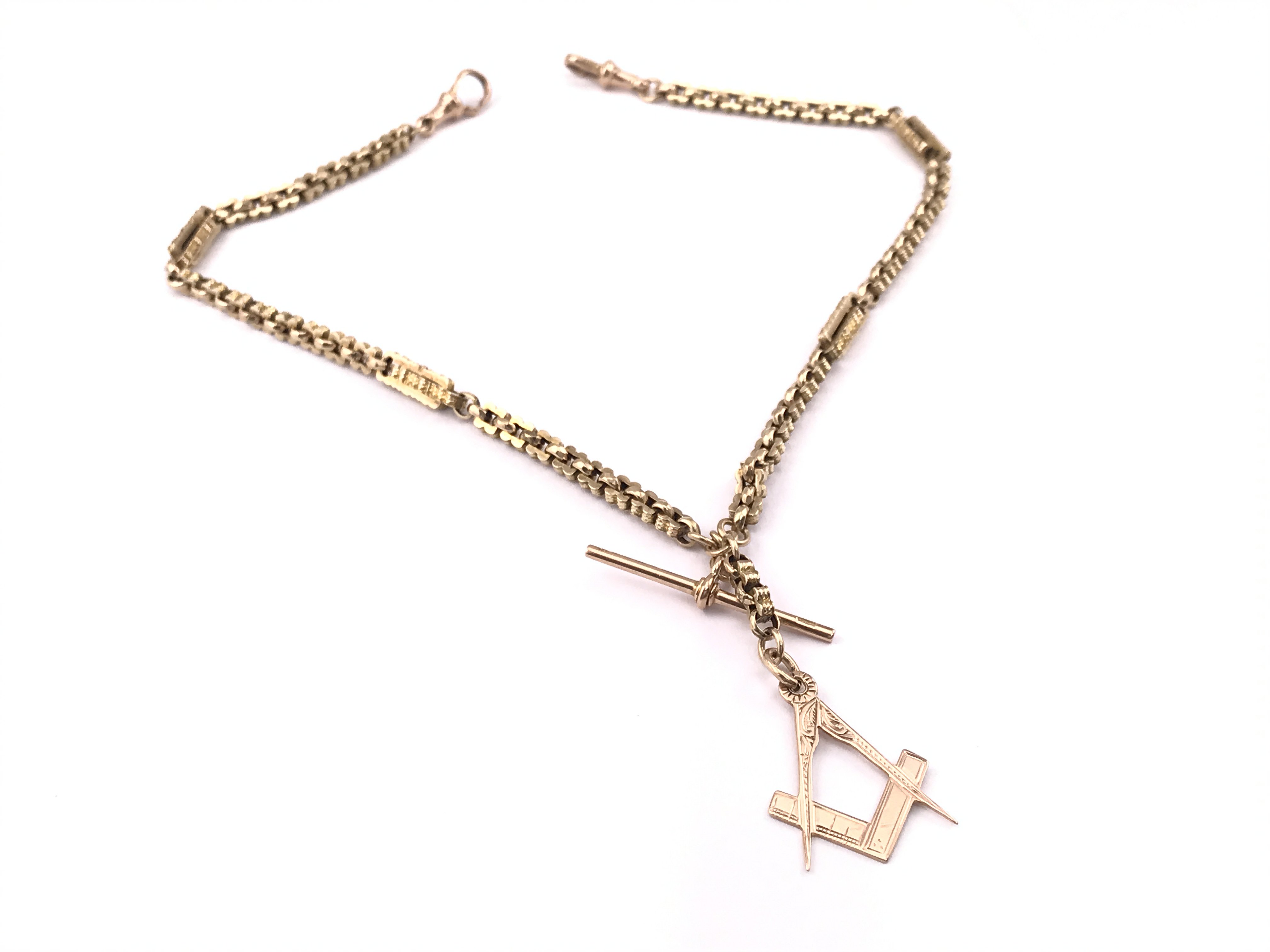 A 9ct gold chain with a 9ct Masonic pendant , total weight 17.4g. Postage category A