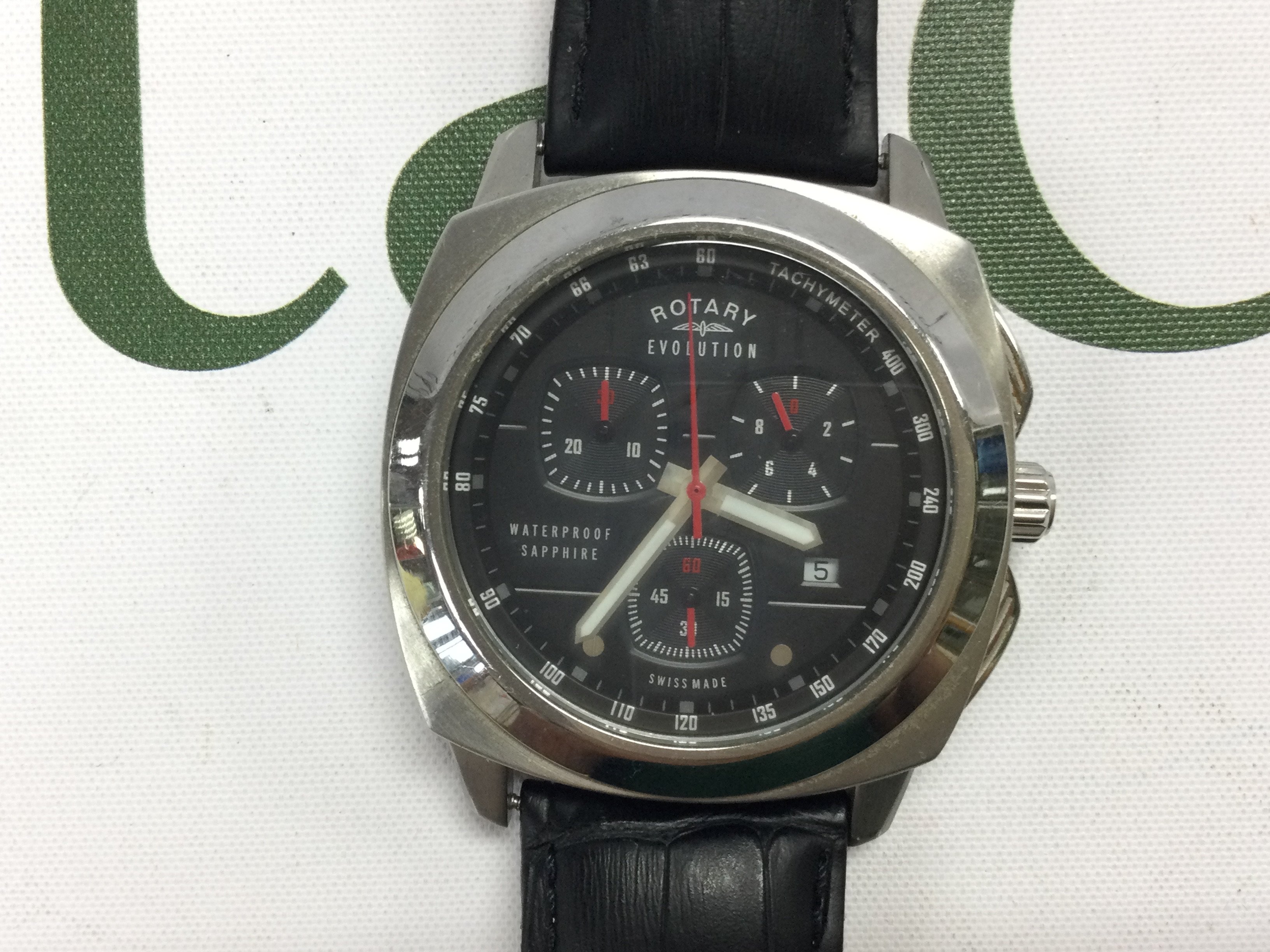 A Rotary evolution Chronograph watch on black leather strap. Postage B