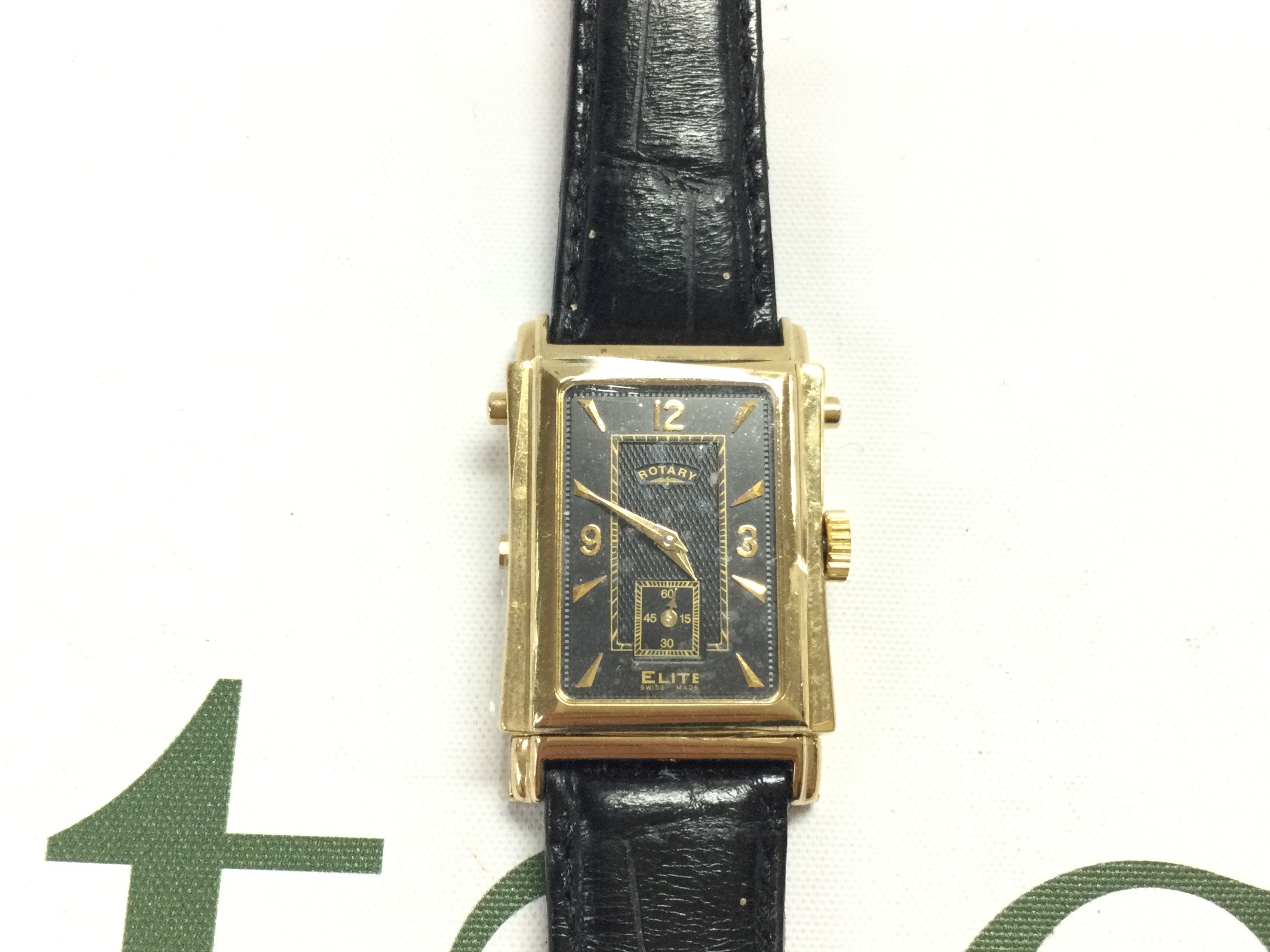 A Rotary elite reverse face watch on black leather strap. Postage B