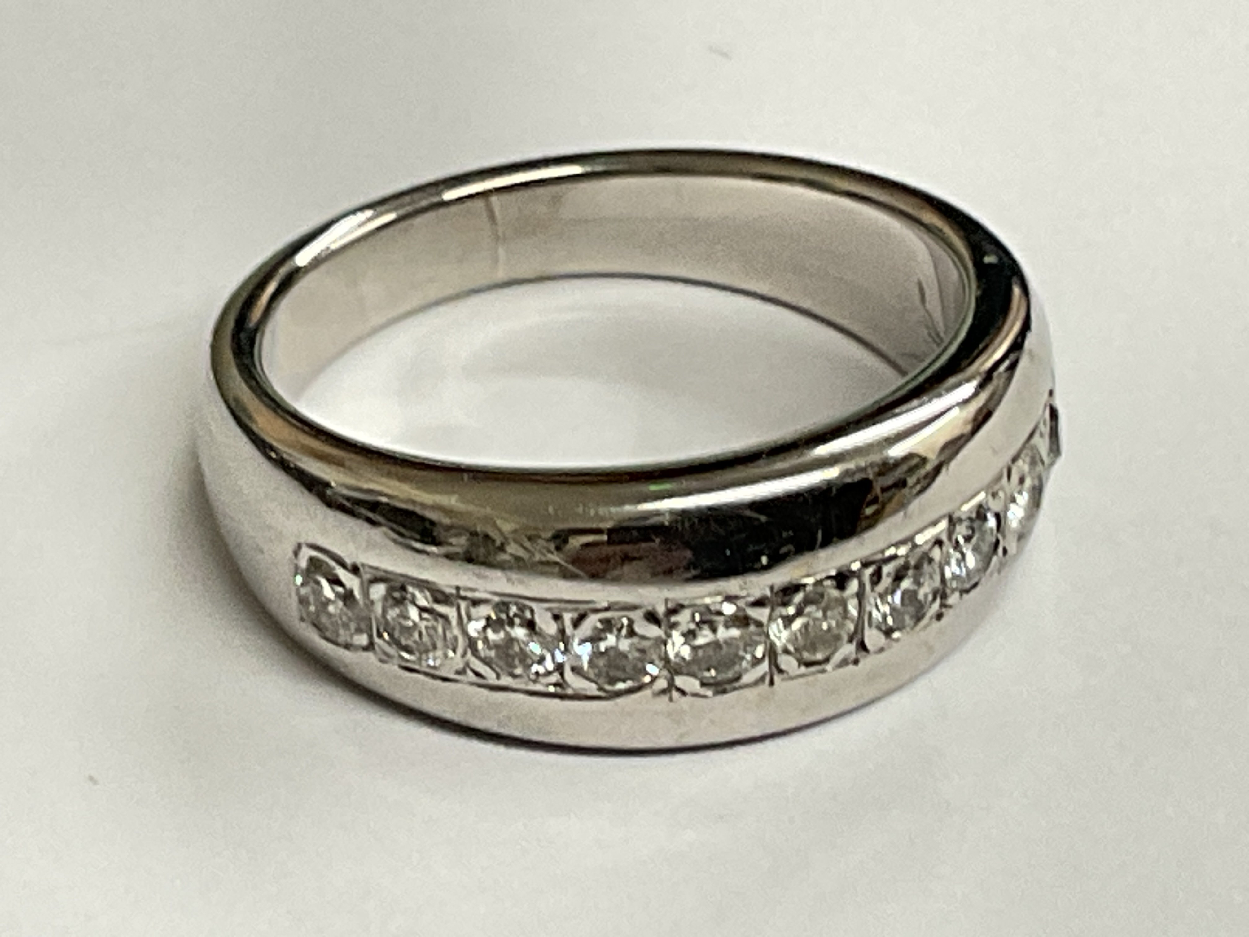 8ct white gold channel set diamond ring. 1.00ct, 12.90 grams. Ring size approx S. postage category A.
