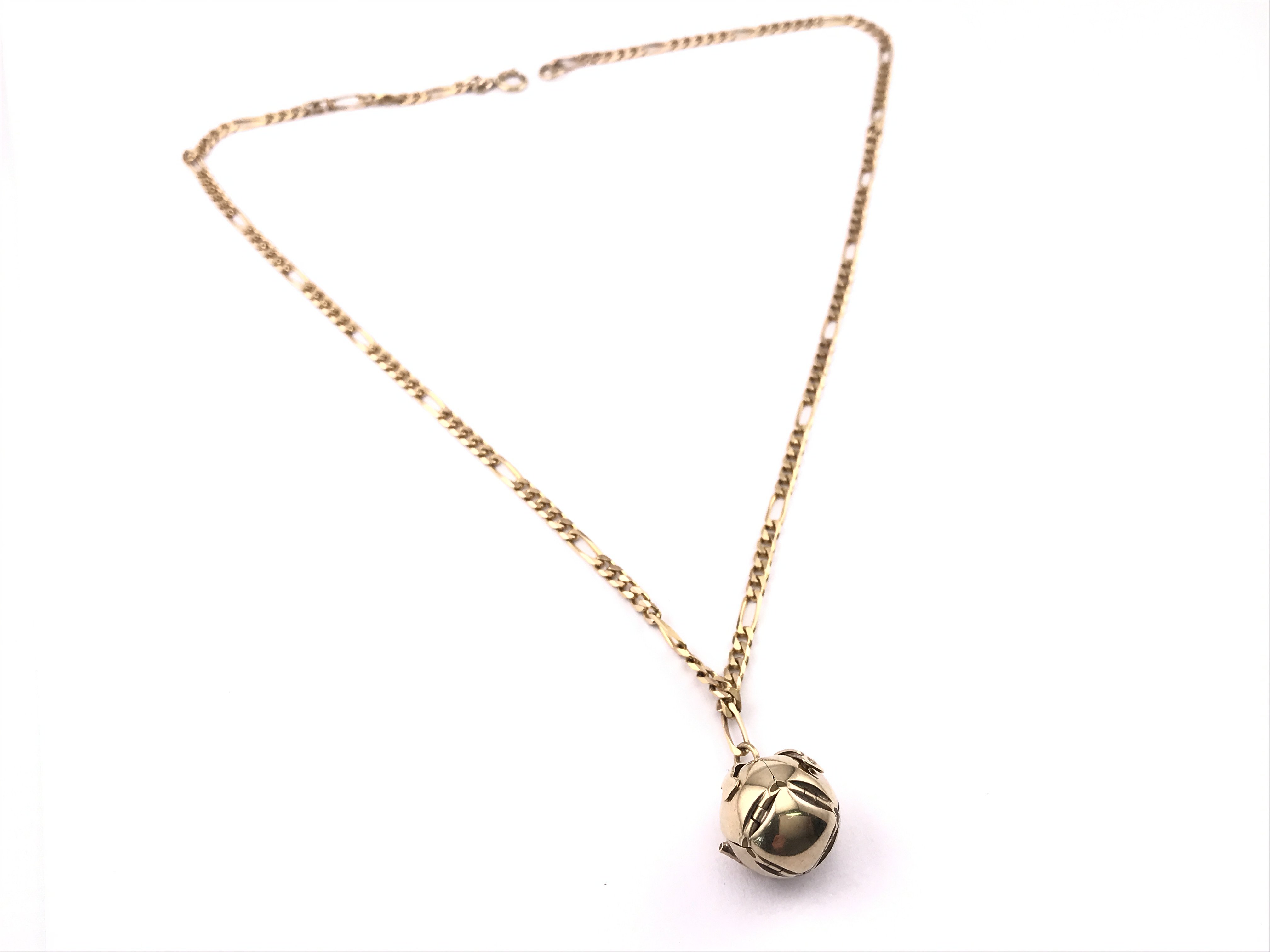 A 9ct gold chain with a 9 carat ball/cross pendant , 22.67g total weight. Postage category A