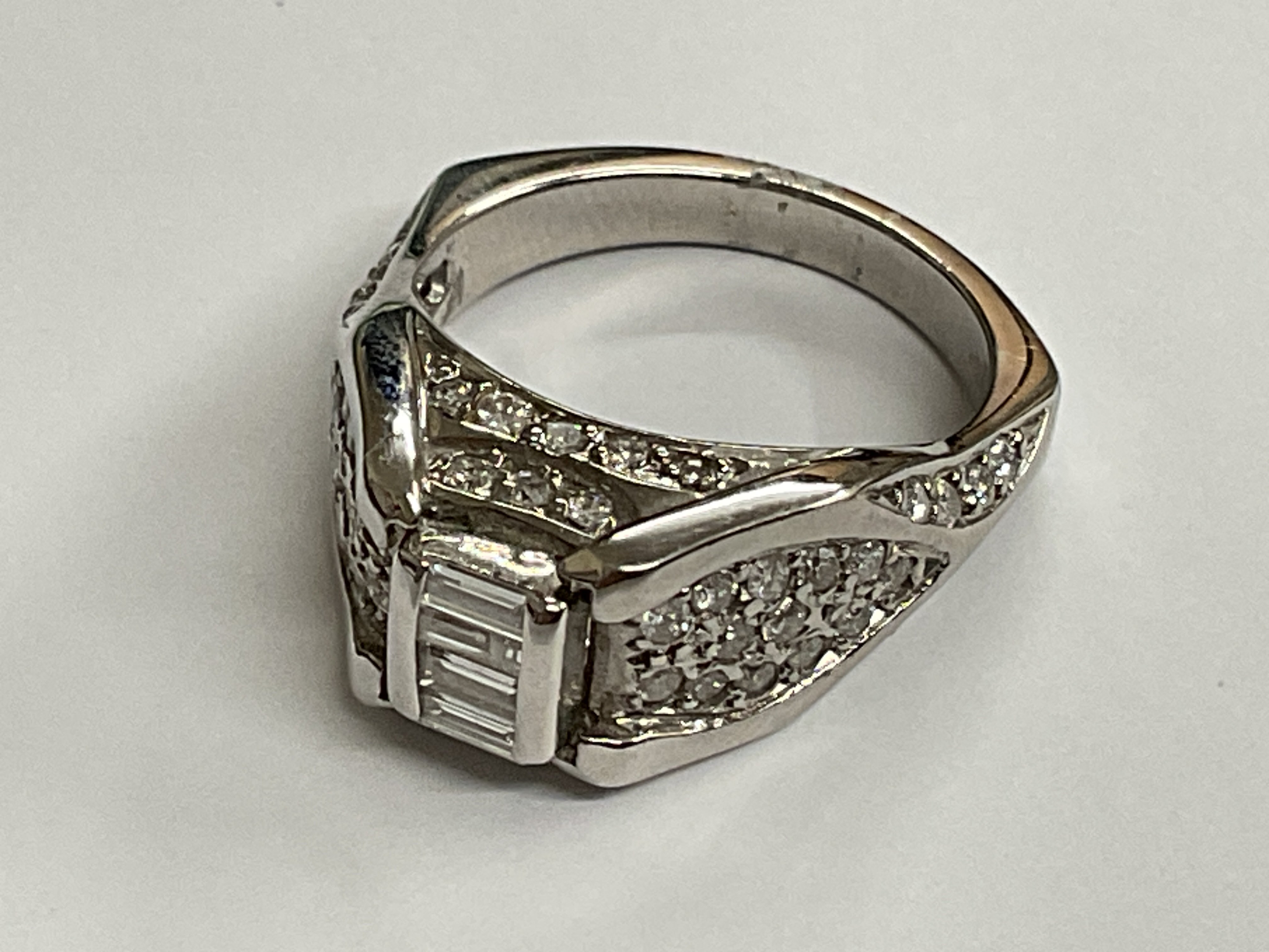 18ct white gold ring. 1.20ct. Approx ring size M. 8.70g. Postage category A.