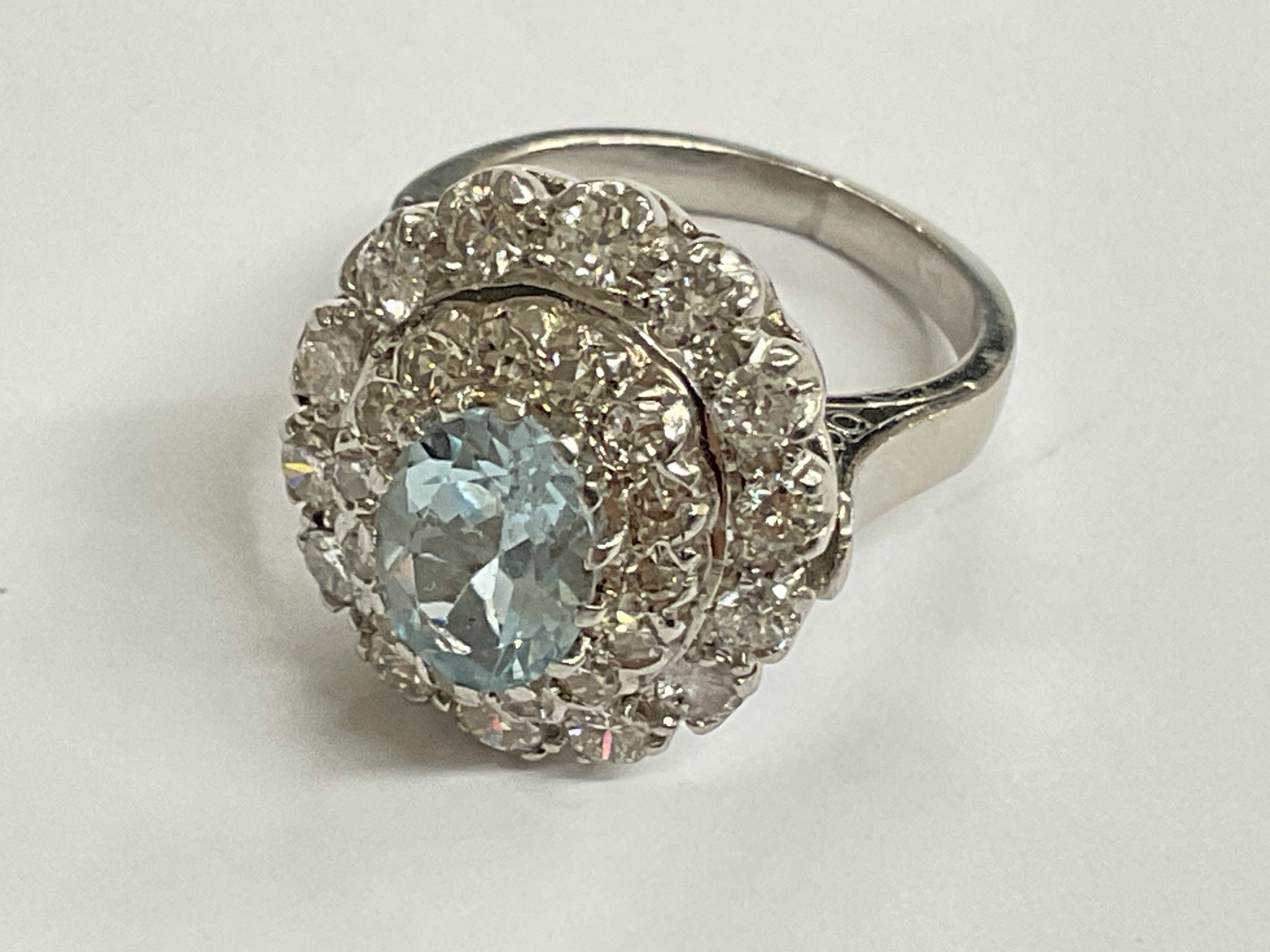 18ct white gold diamond and 1.25 aqua white gold diamond ring. Approx ring size I. Postage category A.