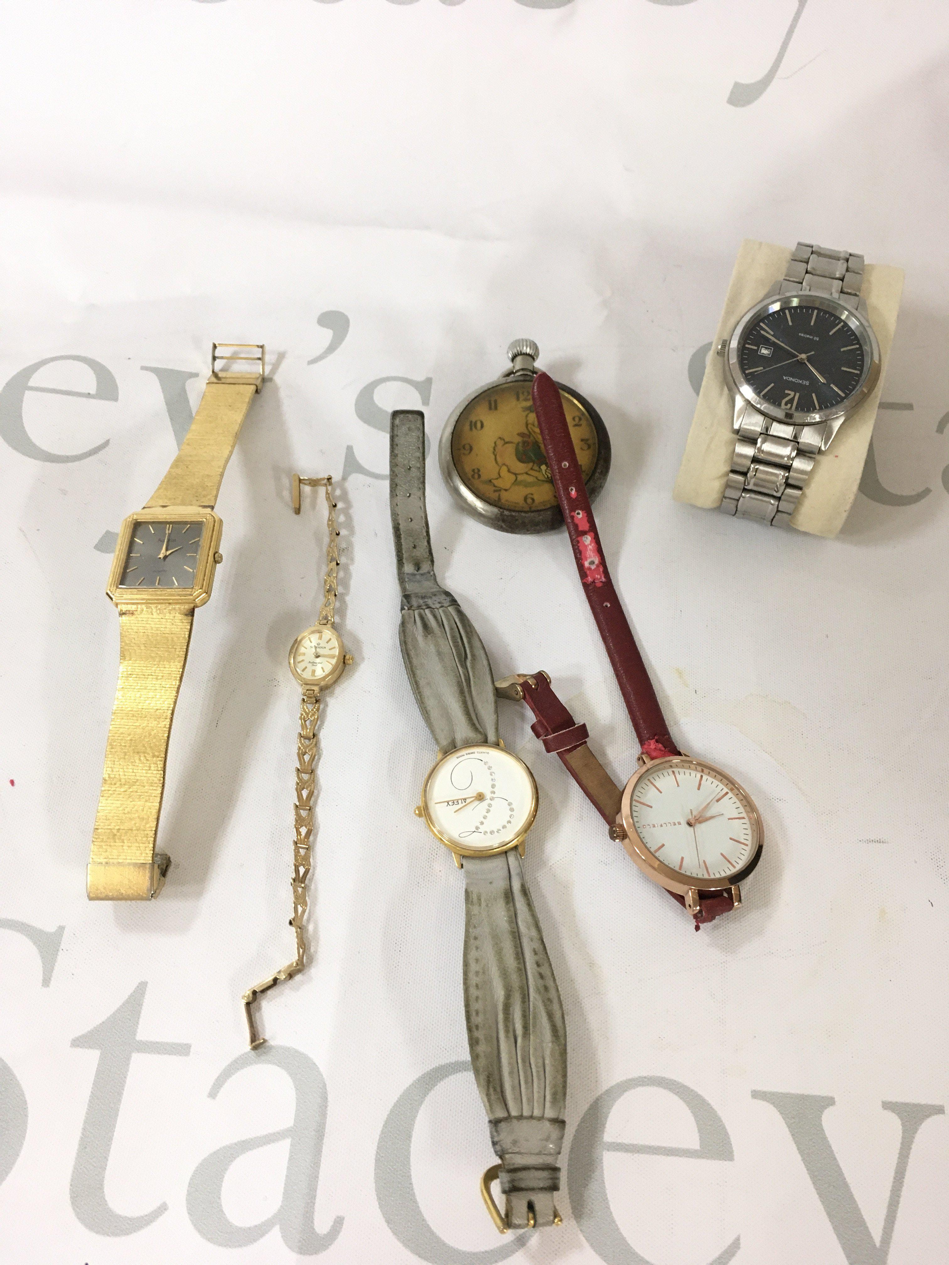 A small collection of watches including a ladies 9ct gold watch.