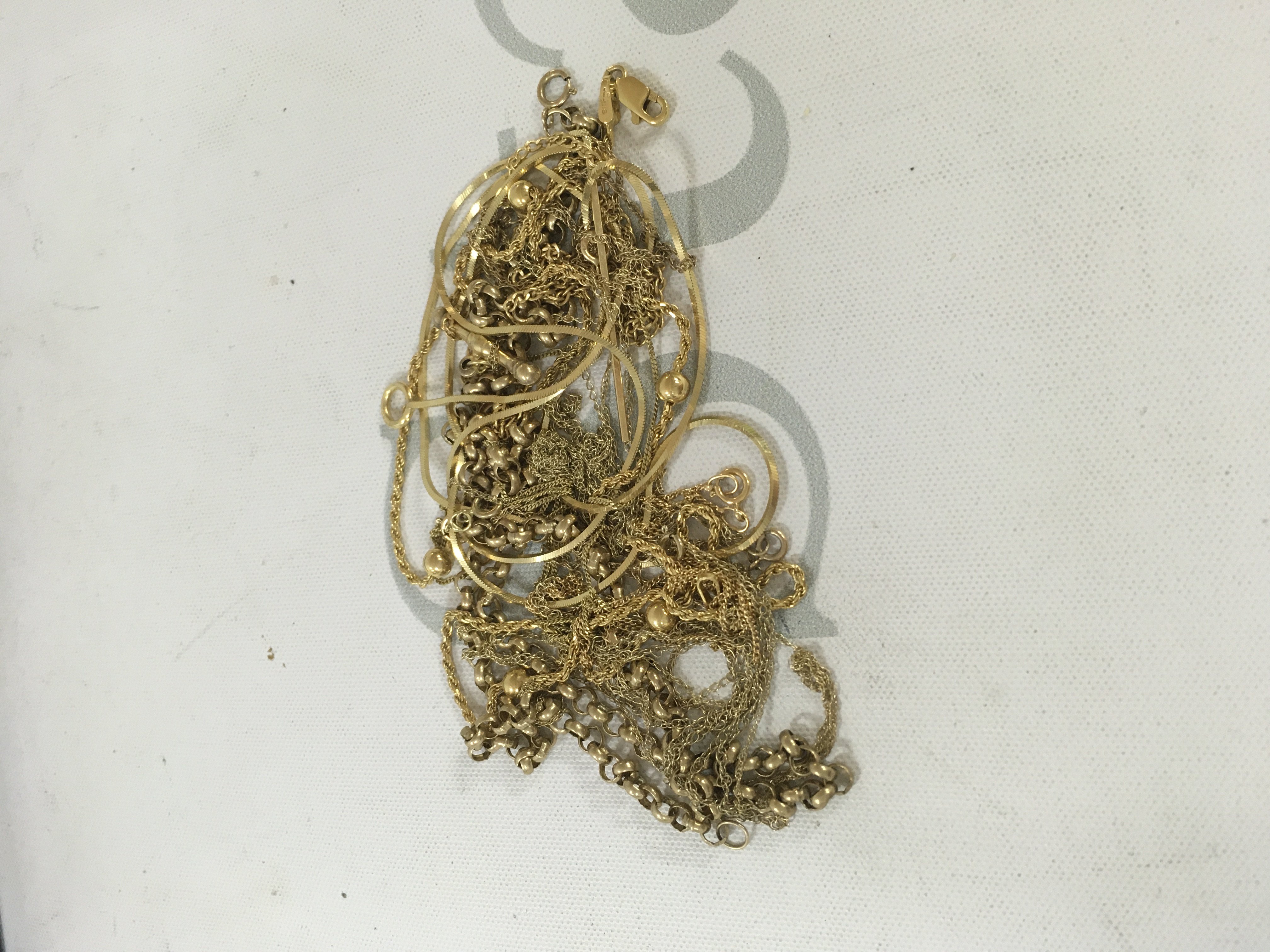 A collection of 9ct gold chains Approx weight 19.5 grams.
