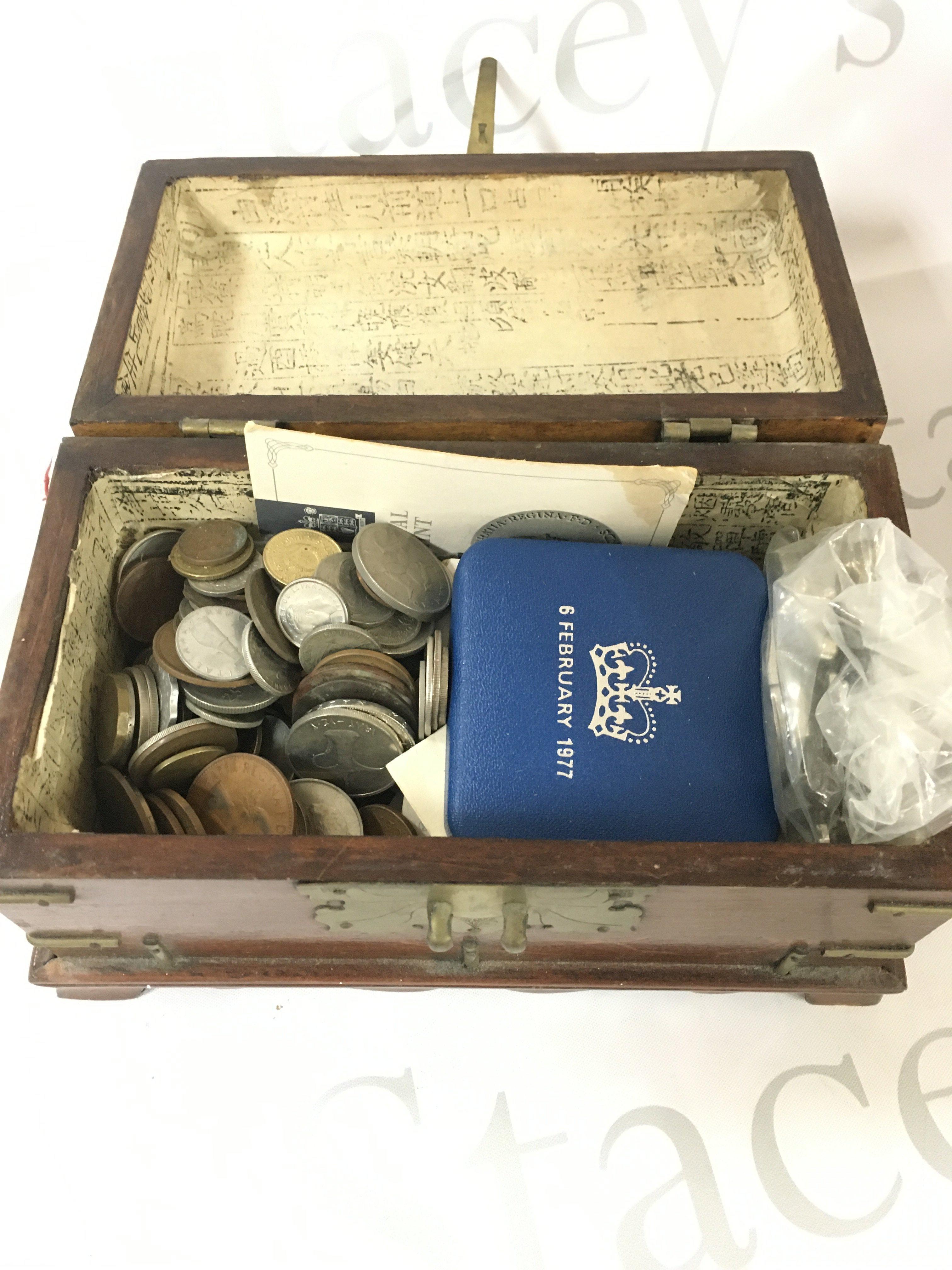 A collection of coins and bank notes.