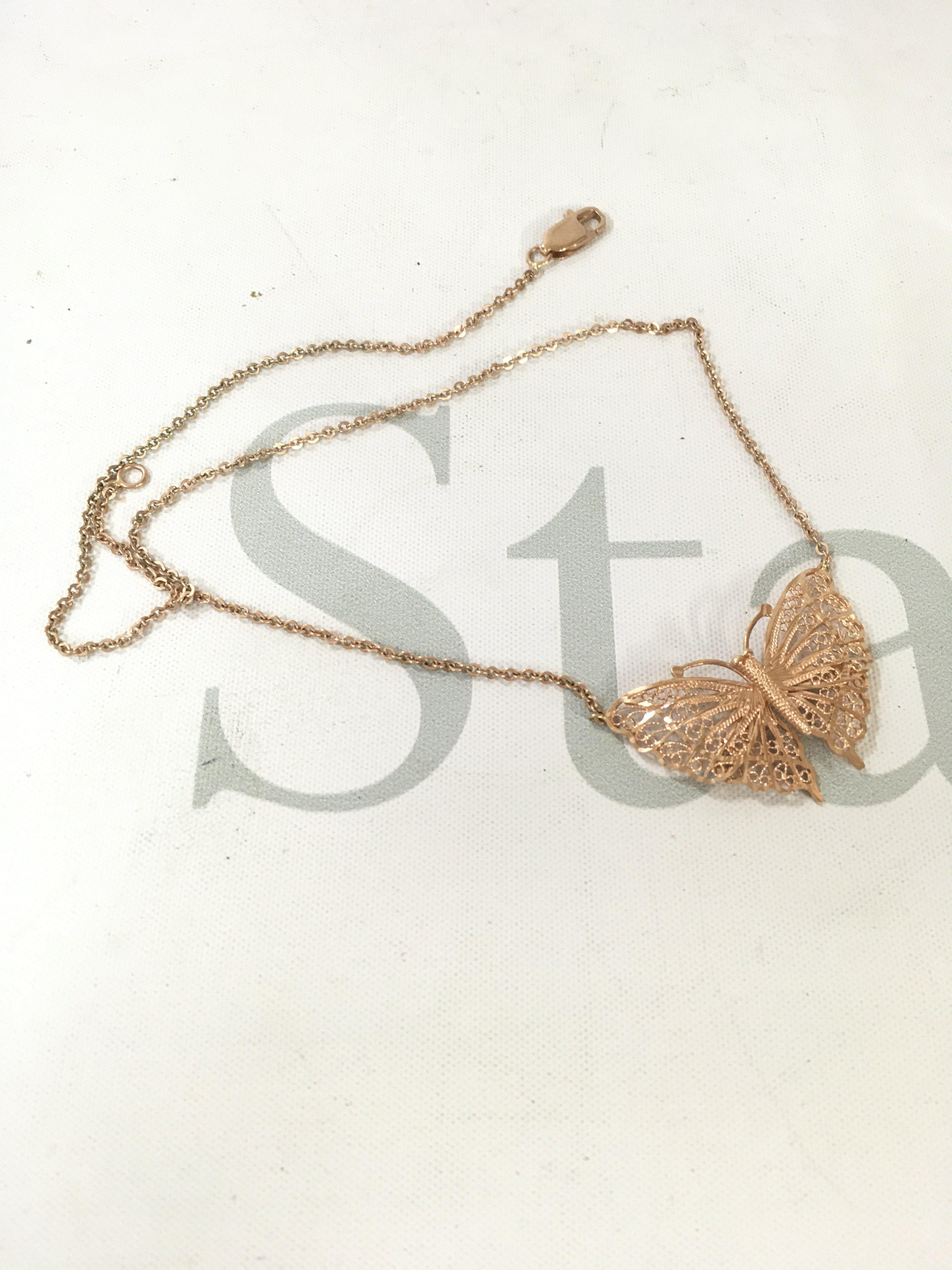 A 9ct rose gold butterfly necklace. Approx weight 5.3 grams.