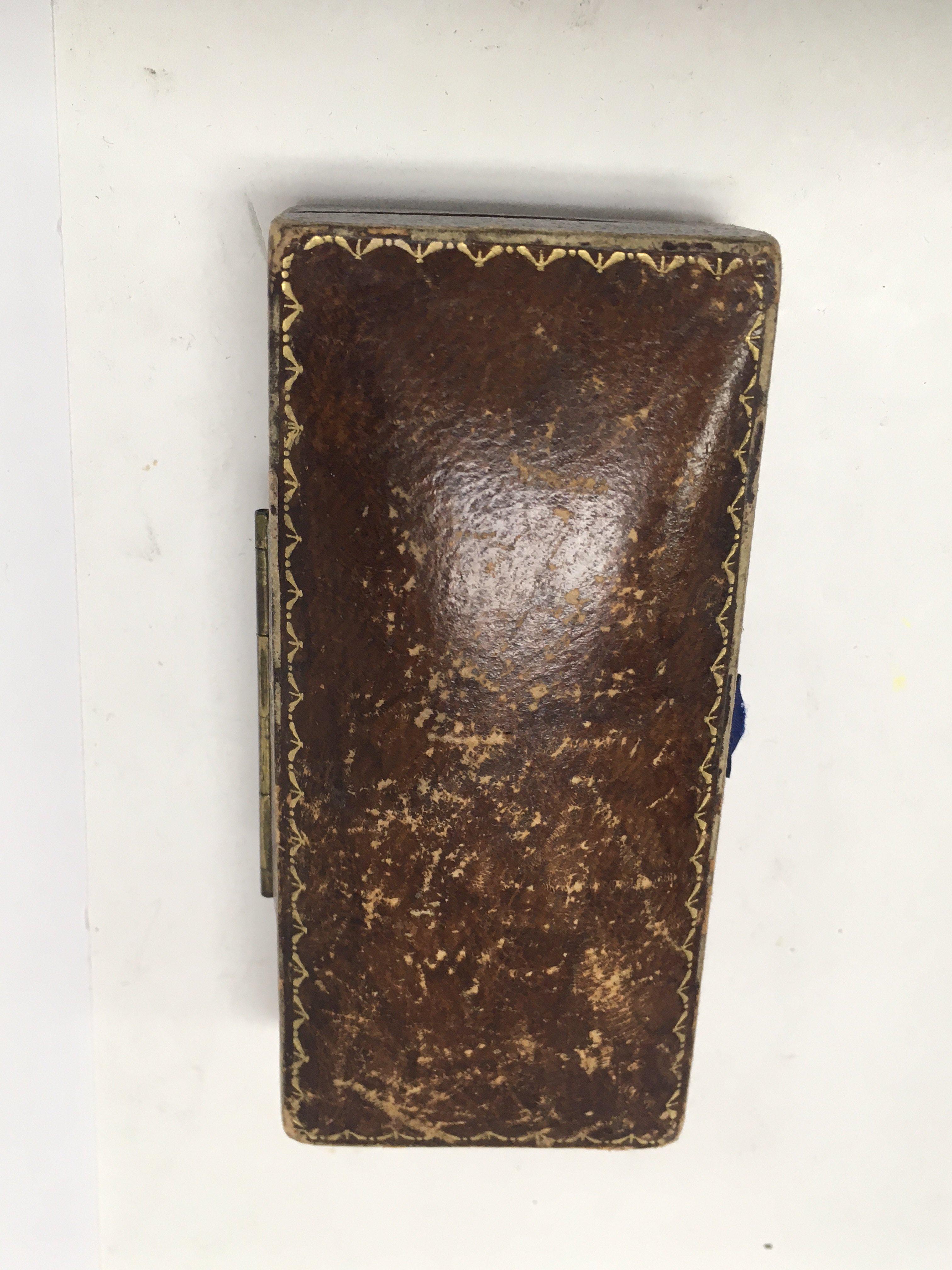 A Art Deco platinum watch the shape dial with Arabic numerals surrounded by diamonds.