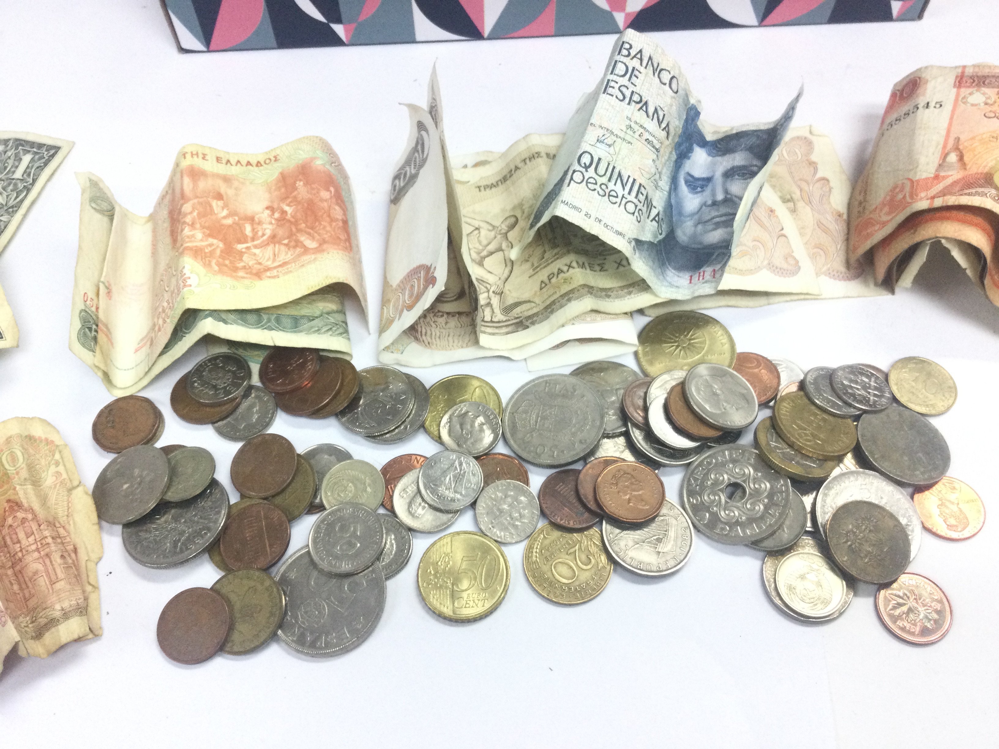 WITHDRAWN - - A collection of mixed world notes and coins. Postage category B. NO RESERVE