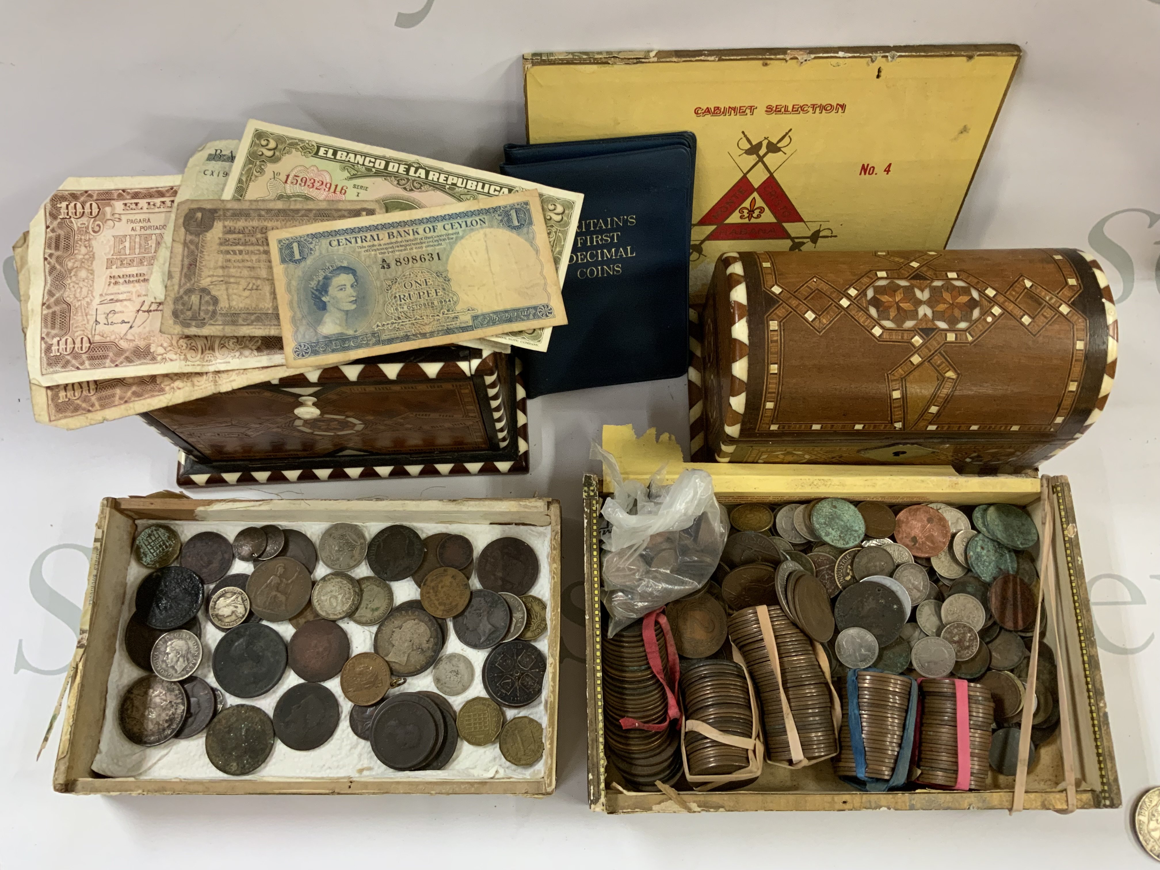 A large collection of mixed world coinage and banknotes. (A)