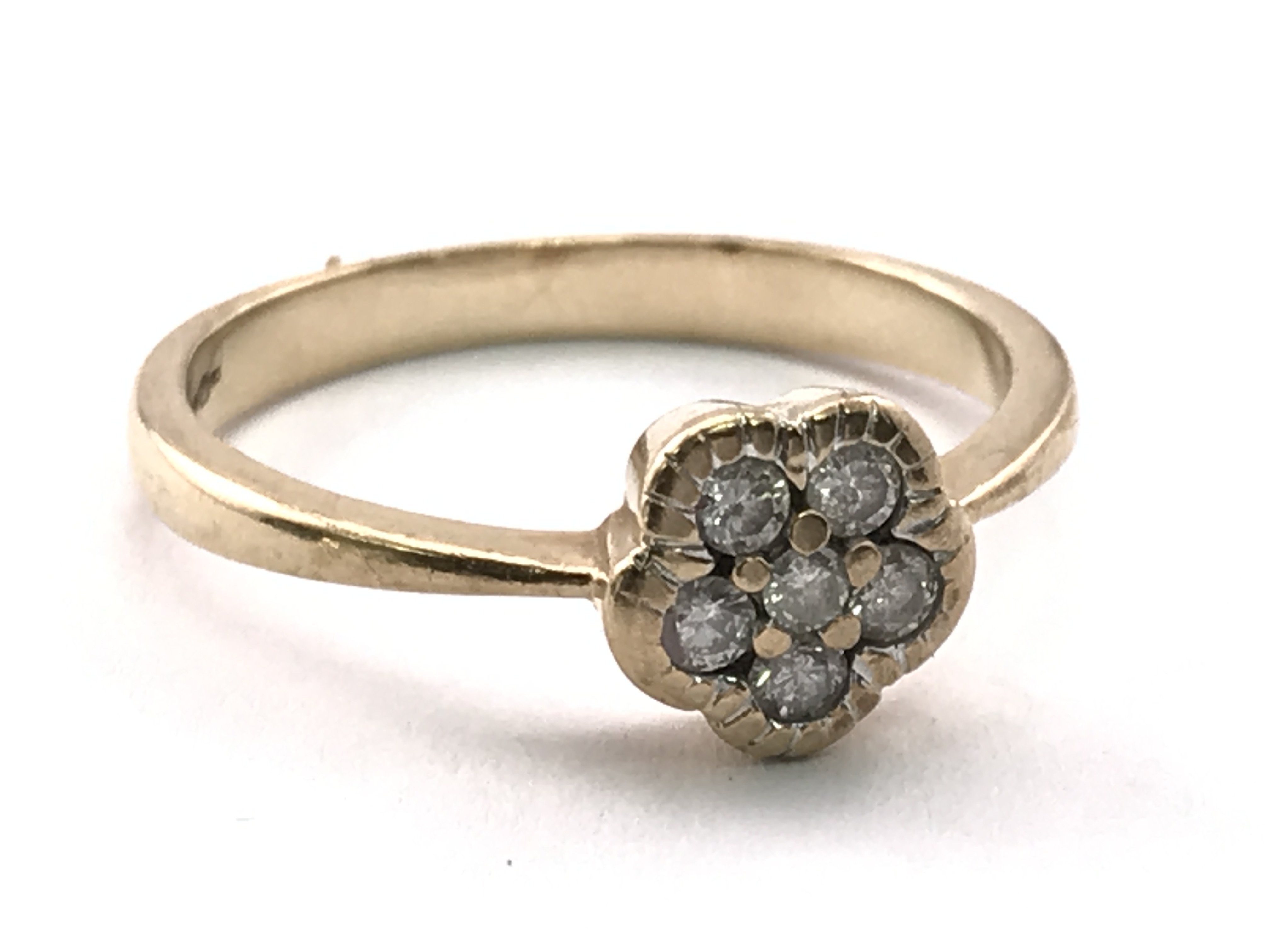 A 9ct gold ring inset with diamonds in the form of a flower, ring size P, 2.3g total weight. Postage category A