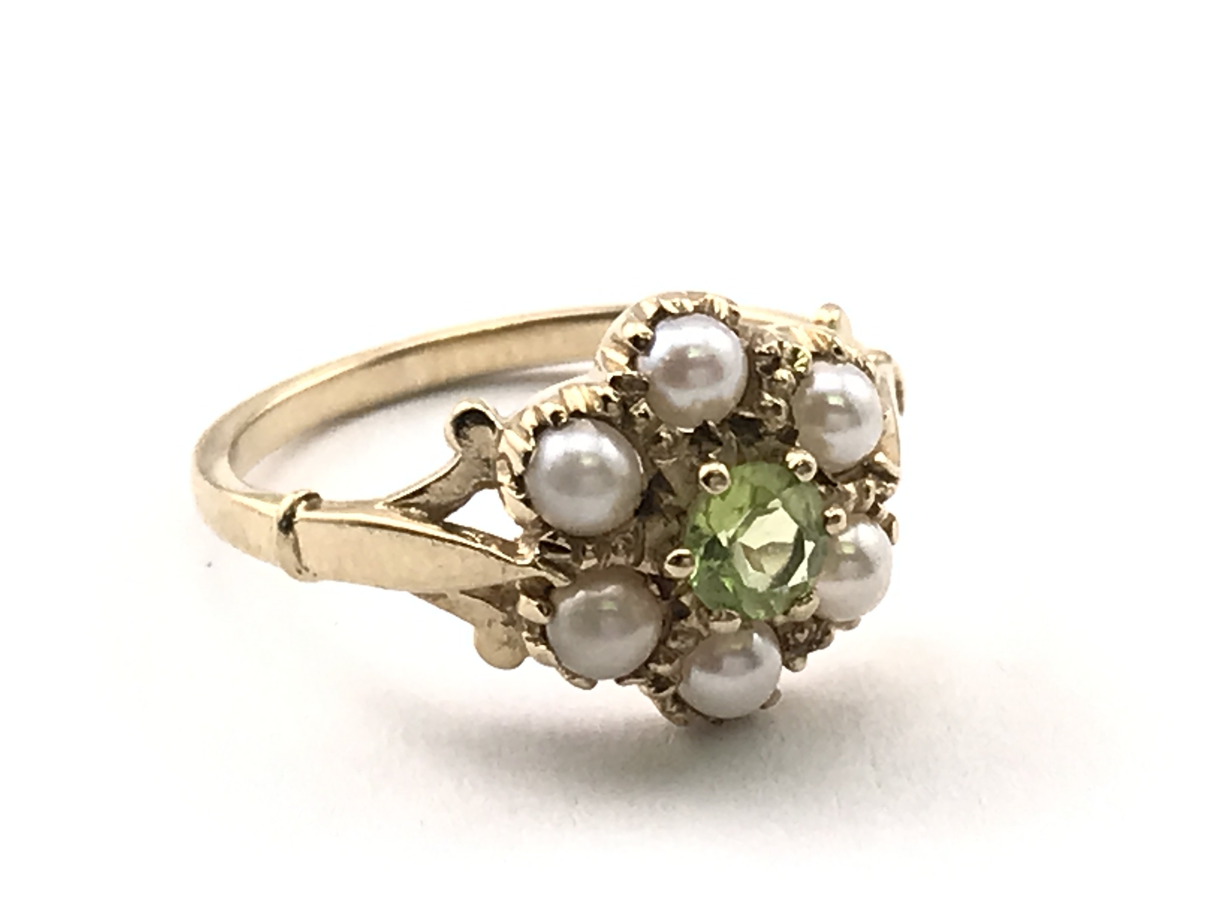 A 9ct gold Pearl and peridot set ring , total weight 2.3g , ring size M/N. Postage category A