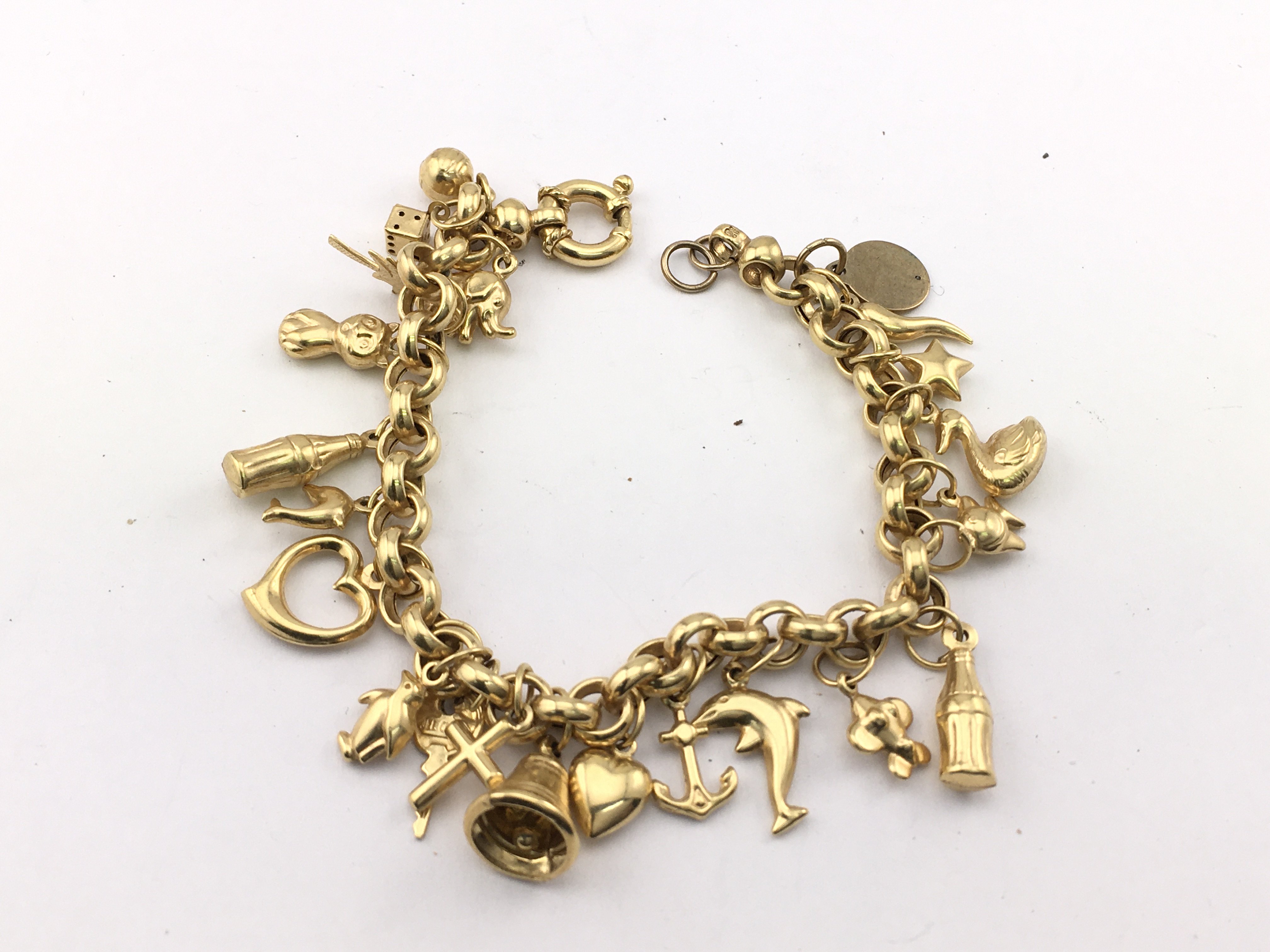 A 9ct gold charm bracelet. 17.22g Postage B