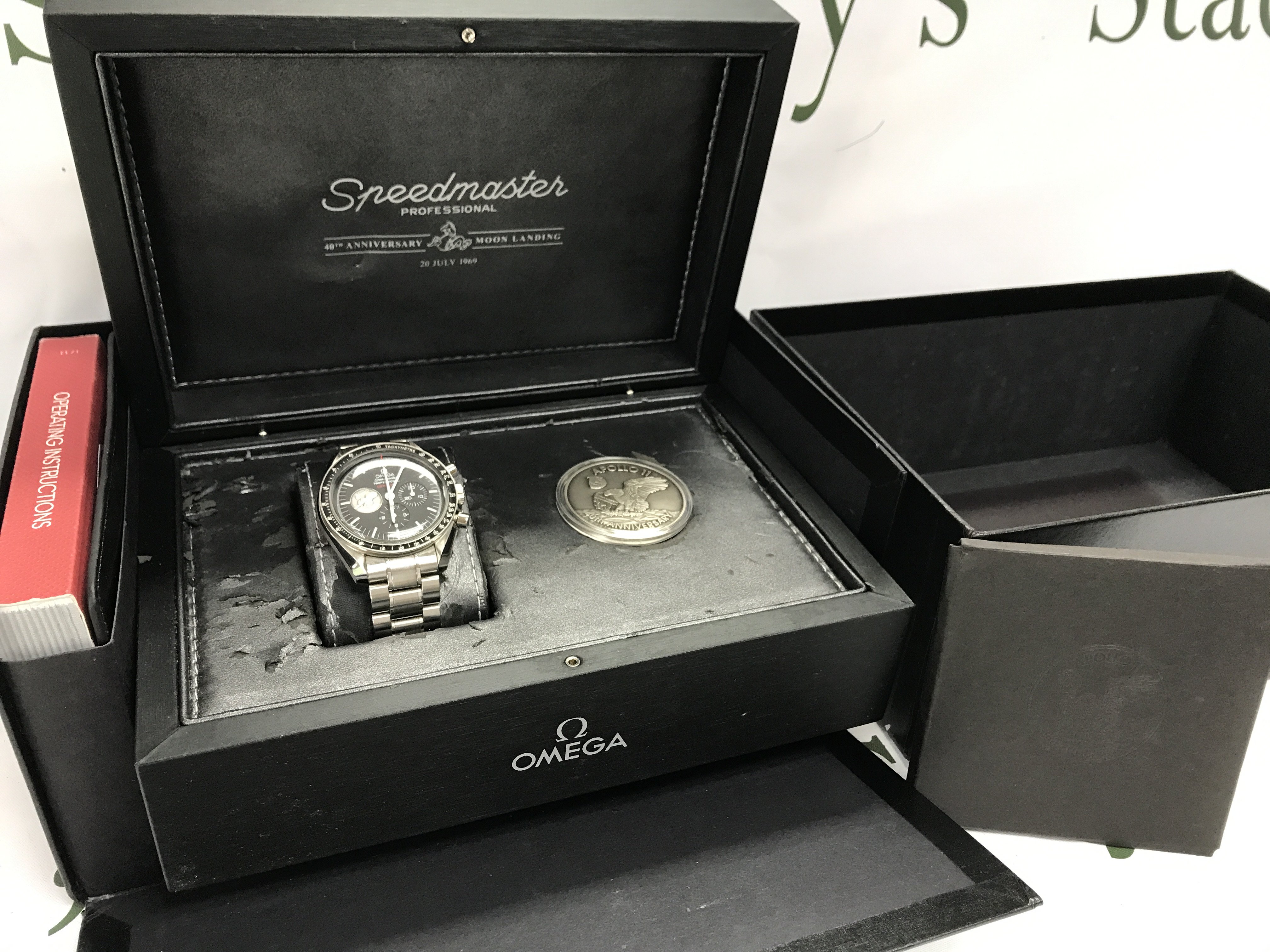 An Omega Speedmaster Apollo 11 40th anniversary limited edition watch with box and paperwork. 7259/7968. Postage category B