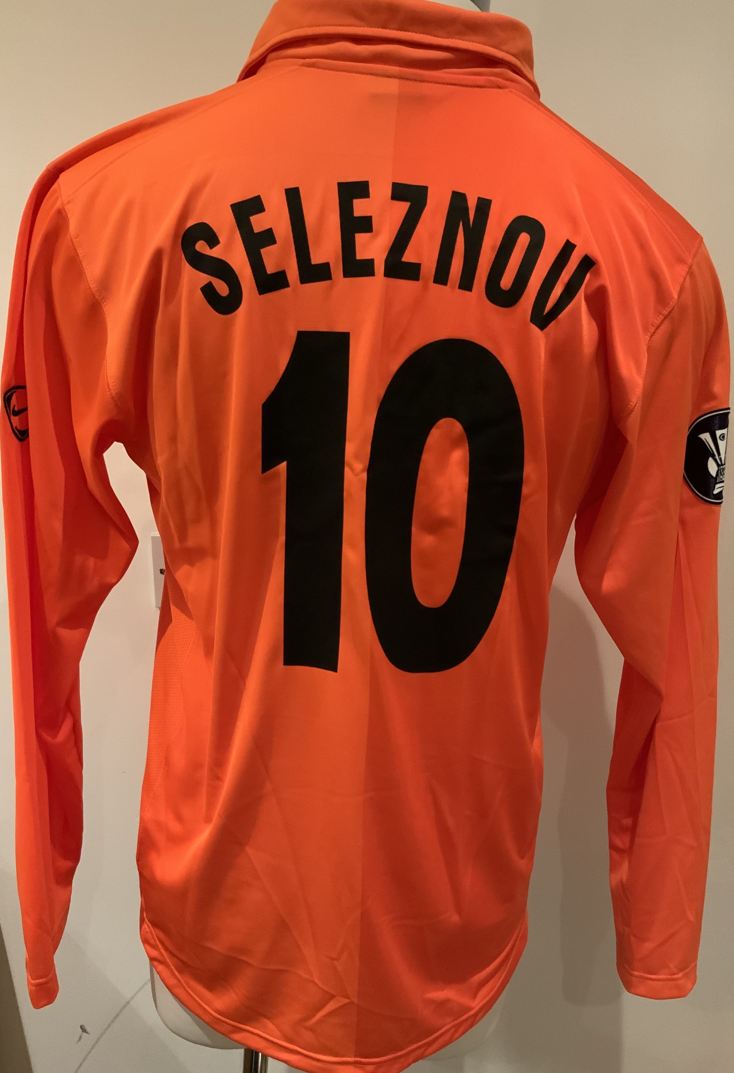 Shakhtar Donetsk 2008 - 2009 Match Worn Football Shirt: Orange long sleeve shirt with Europa League badging to sleeves. Seleznov 10 to rear. Worn v Tottenham on 19 February 2009. Shakhtar Donetsk won 2-0 and player scored the first goal. 