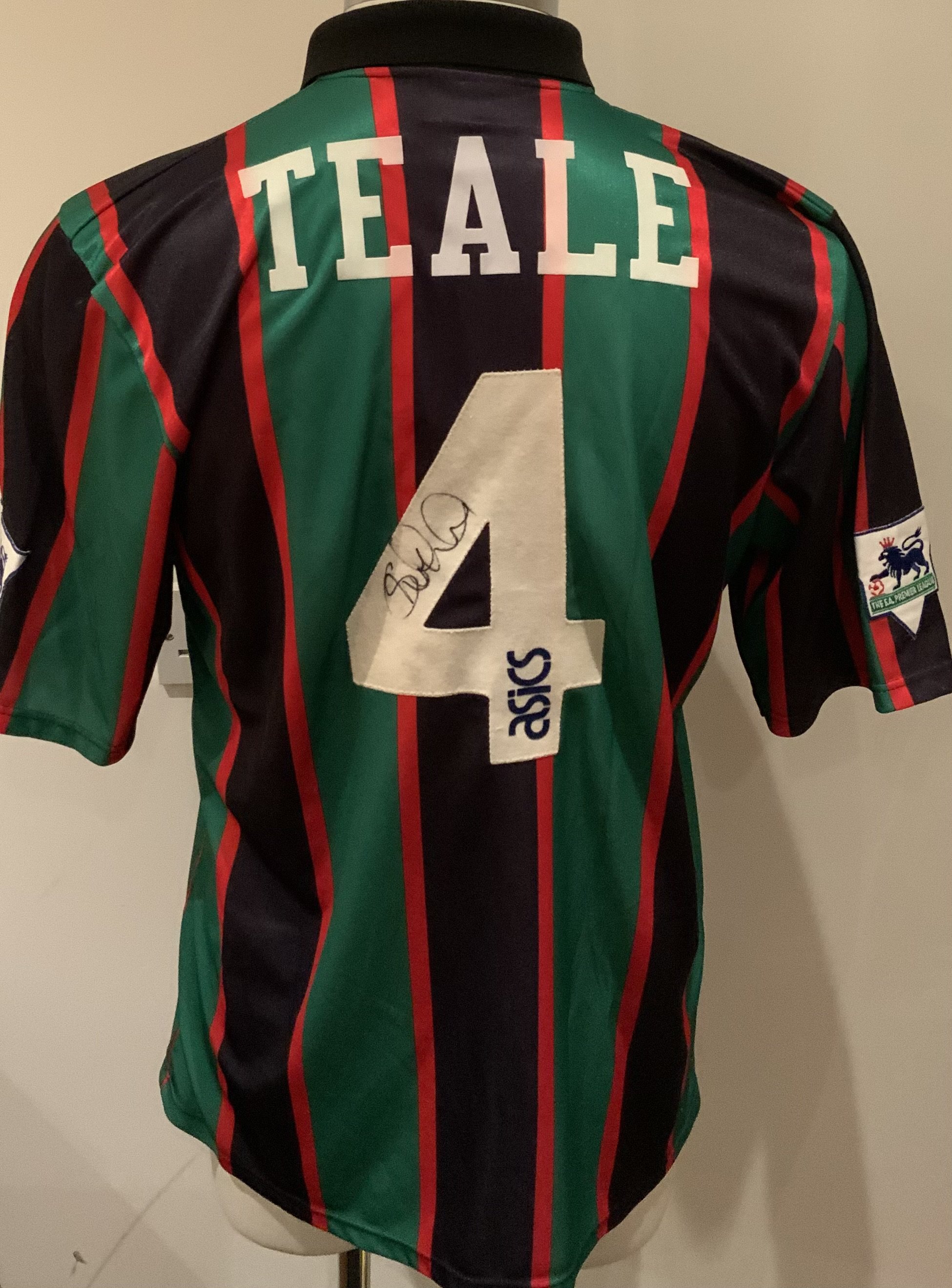 Aston Villa Match Worn Football Shirt: Green and black short sleeve shirt with Premier League badges to sleeves. Teale 4 to rear. Signed to the number by the player.