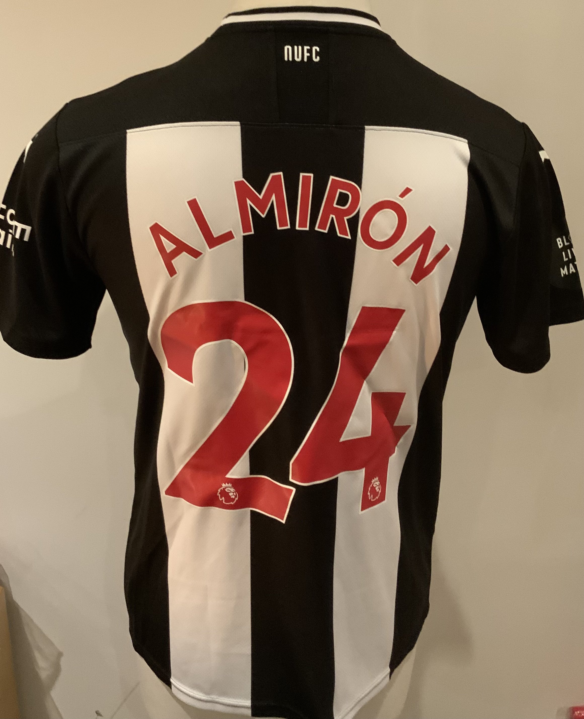 Newcastle 2019 - 2020 Match Worn Football Shirt: Black and white short sleeve shirt with Black Lives badge to sleeves. Almiron 24 to rear. Worn  v Tottenham on 15 July 2020.