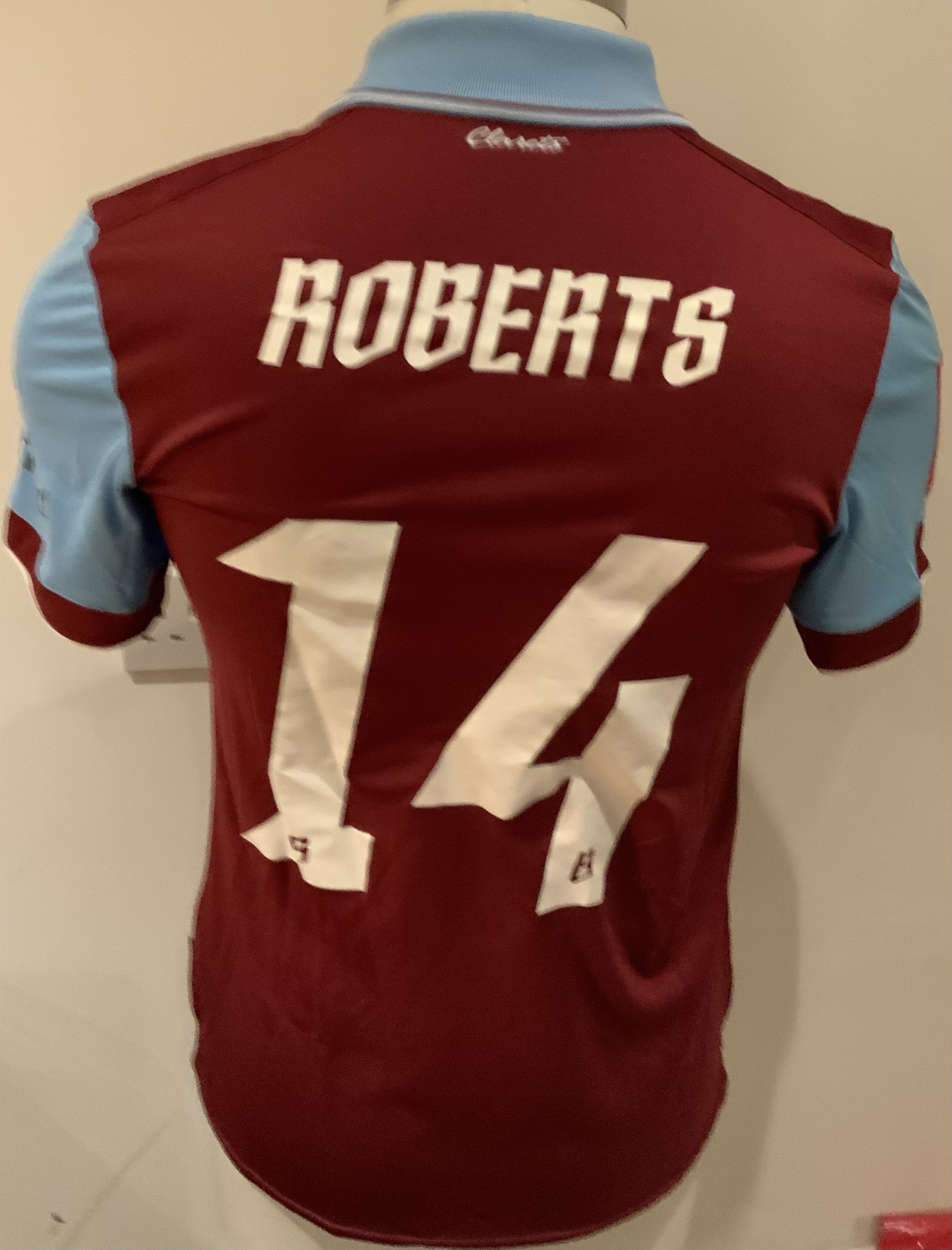 Burnley 2023 - 2024 Match Issued Football Shirt: Claret and blue short sleeve shirt with FA Cup badges to sleeves. Roberts 14 to rear. Issued v Tottenham on 5 January 2024. Player was unused substitute. 