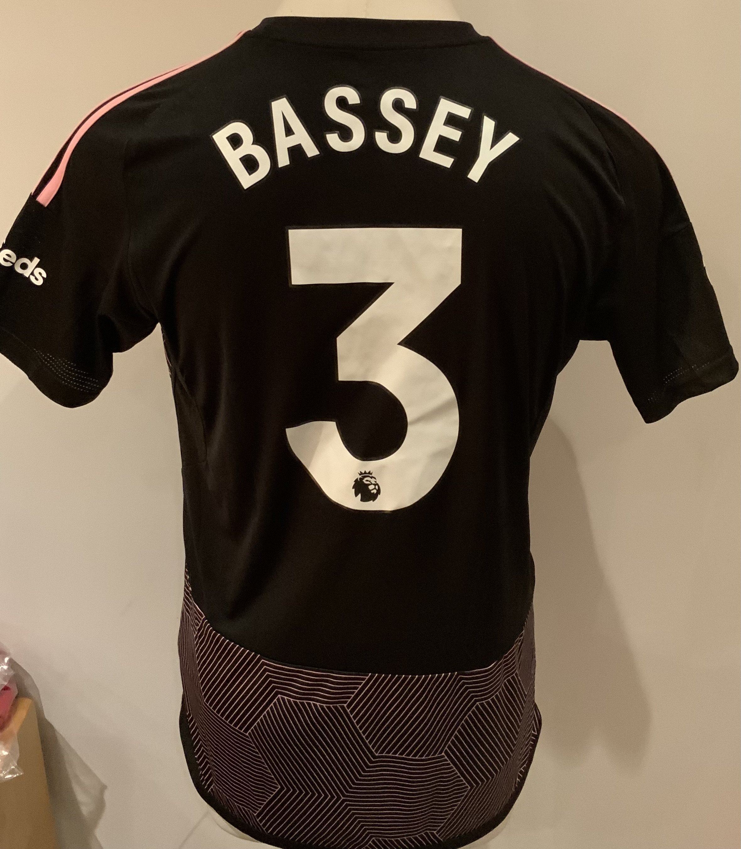 Fulham 2023 - 2024 Match Worn Football Shirt: Black and pink short sleeve shirt with Premier League badges to sleeves. Bassey 3 to rear. Worn v Tottenham on 23 October 2023.
