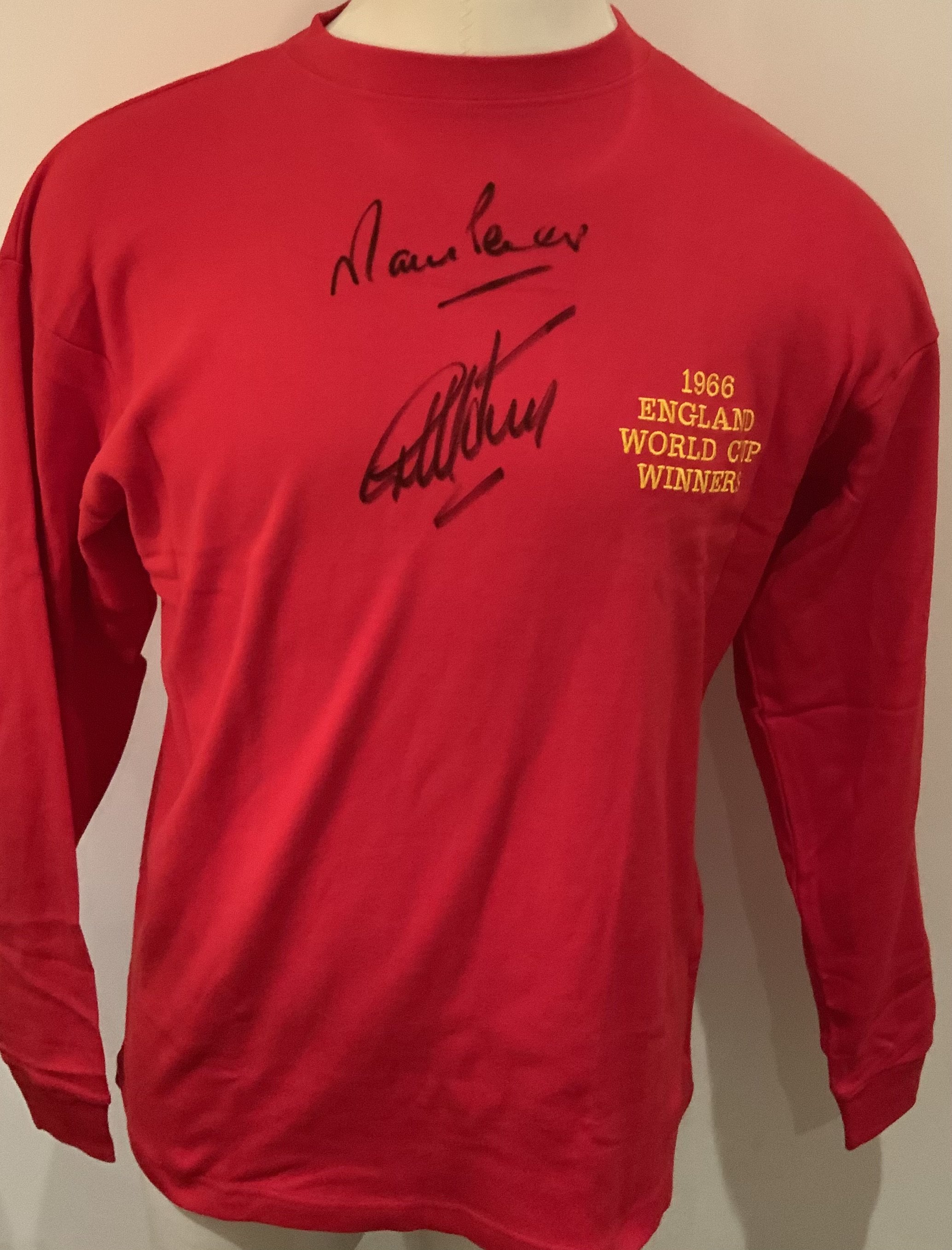 England 1966 World Cup Final Winners Signed Replica Shirt: Signed to front by winning goalscorers Geoff Hurst and Martin Peters. COA from reputable source. 