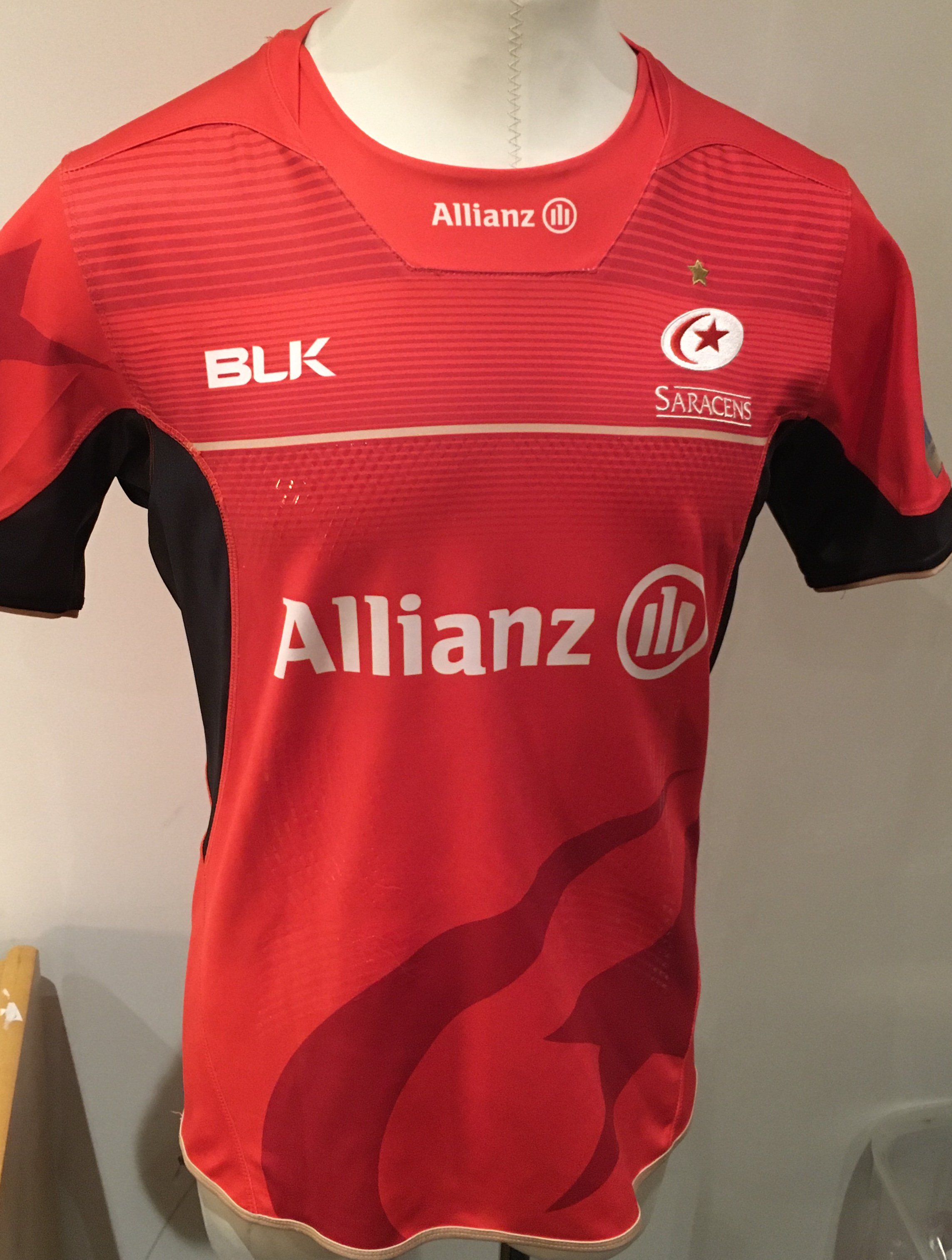 Saracens 2016 - 2017 Away Match Worn Rugby Union Football Shirt: Red short sleeve BLK XL excellent condition shirt worn by Michael Rhodes. Aviva Champions 2015/16 badging. GPS tracking pocket present at neck 