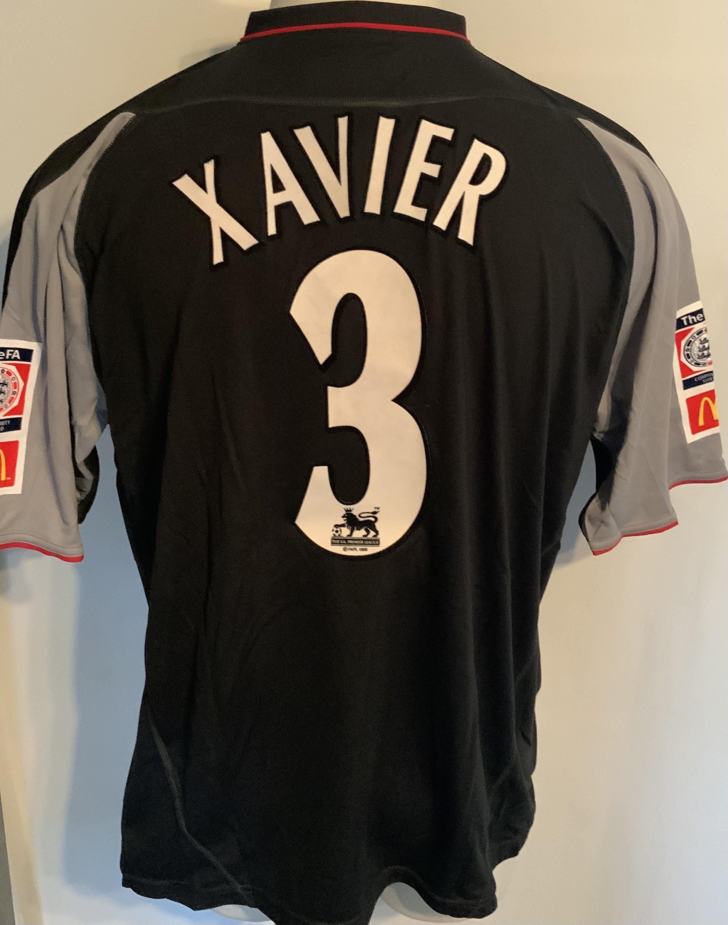 Liverpool 2002 Match Issued Charity Shield Football Shirt: Black short sleeve  Reebok shirt with FA Community Shield badging to sleeves. Xavier 3 to rear. Issued v Arsenal on 11 August 2002. Comes with signed COA from the player. Matchday programme is included.