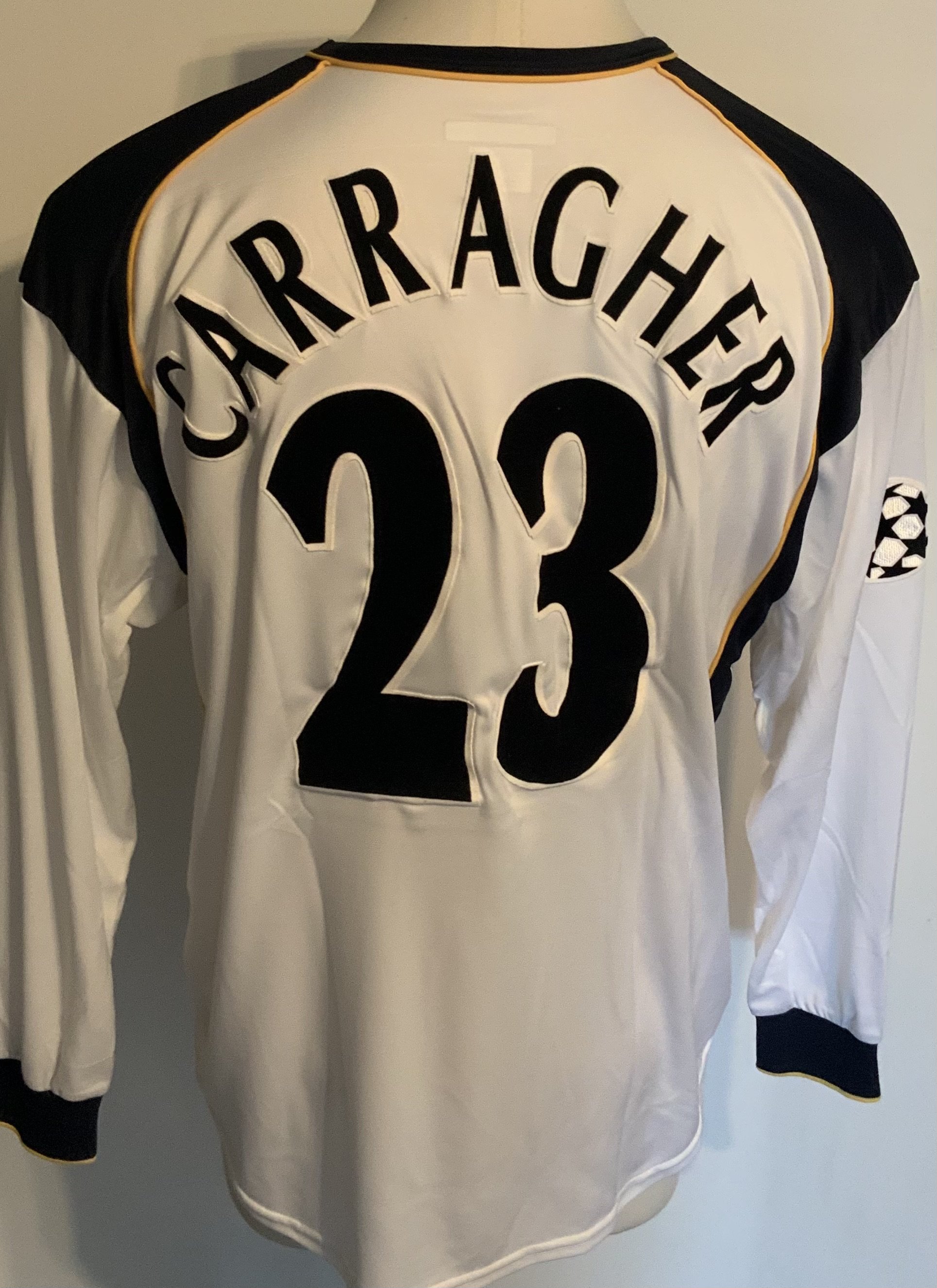 Liverpool 2001 - 2002 Away Match Worn Football Shirt: White long sleeve Reebok shirt with Champions League badging to sleeves. Carragher 23 to rear. Worn v Barcelona on 13 March 2002. Comes with signed COA from the player. Includes match programme, press photo and press conference information pack. 