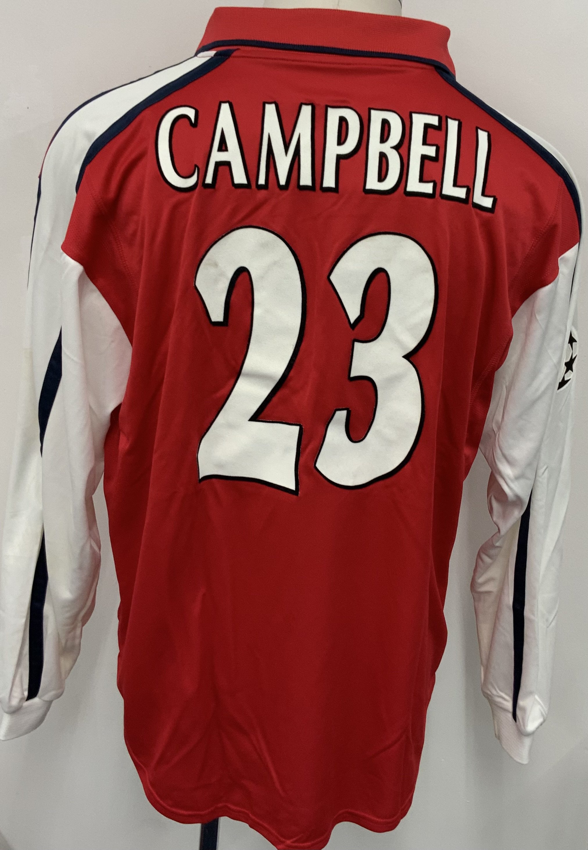 Arsenal 2001 - 2002  Home Match Worn Football Shirt: Red and white long sleeve  Nike Dreamcast shirt with Champions League badging to sleeve. Campbell 5 to rear. Worn v Bayer Leverkusen on 27 February 2002. Comes with signed COA from the player. 