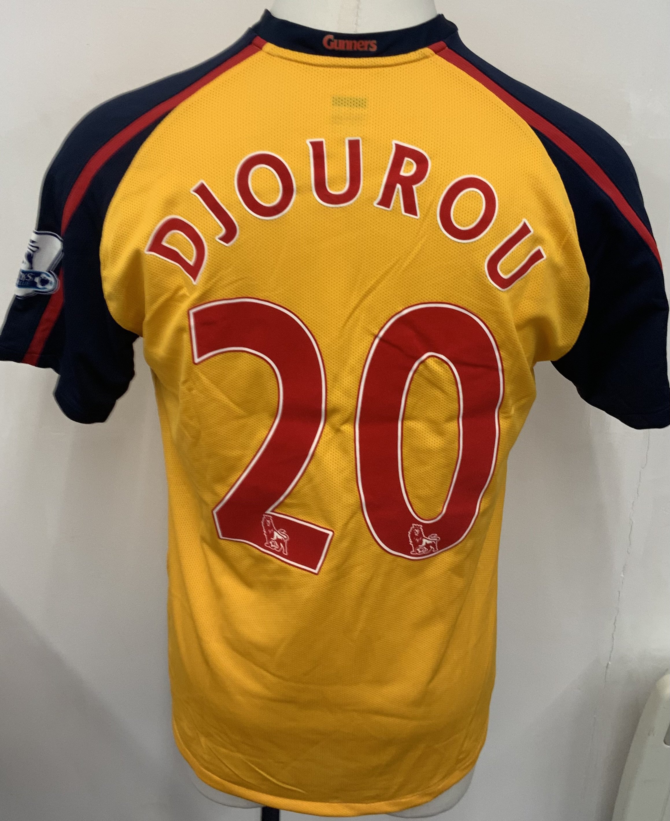 Arsenal 2008 - 2009 Away Match Worn Football Shirt: Yellow short sleeve Nike shirt with Premier League badging to sleeves. Djourou 20 to rear. 