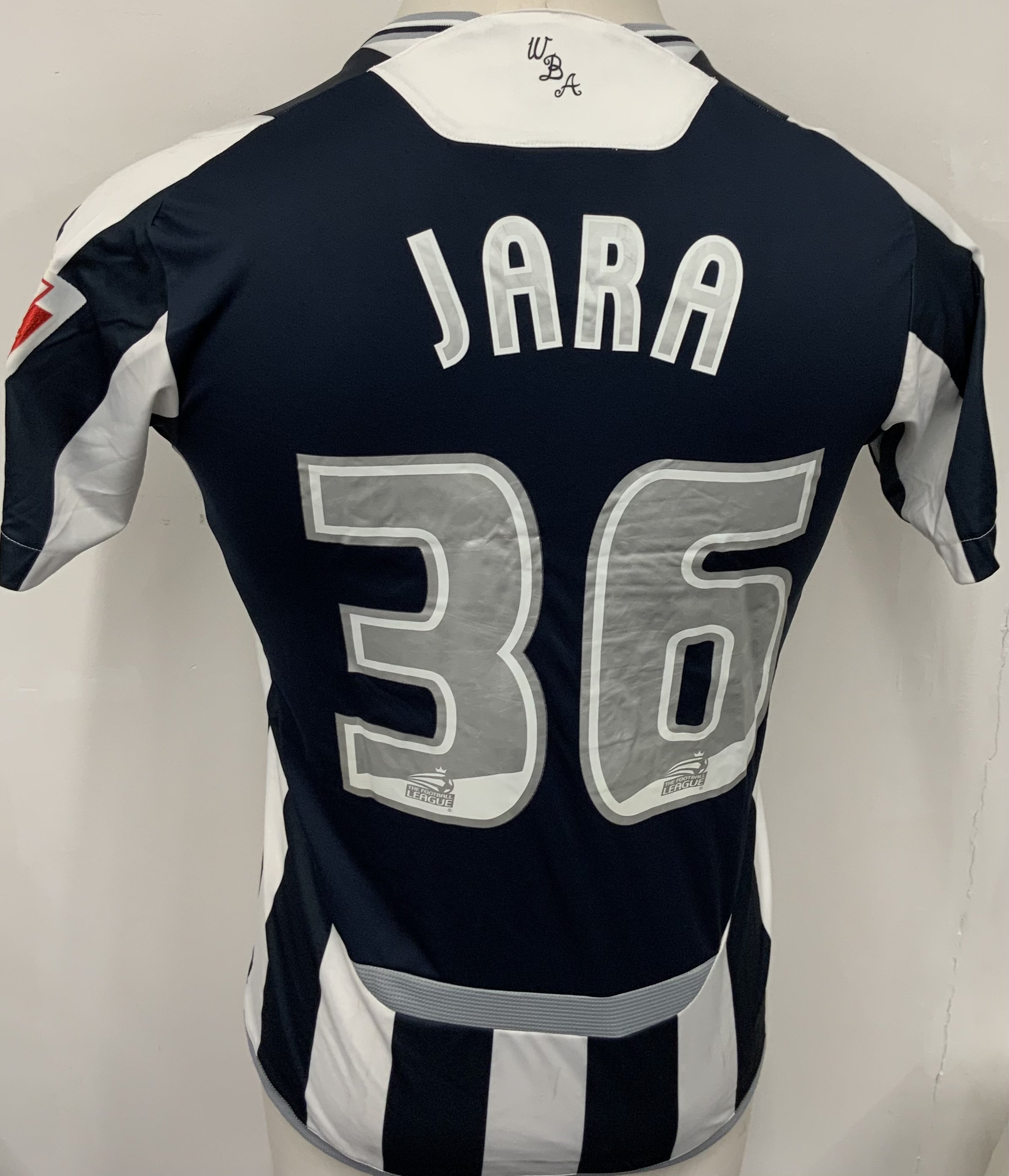 West Brom 2009 - 2010 Match Worn Football Shirt: Blue and white short sleeve shirt with number 36 Jara to rear. Rare unsponsored shirt with Coca Cola sleeve badging. 