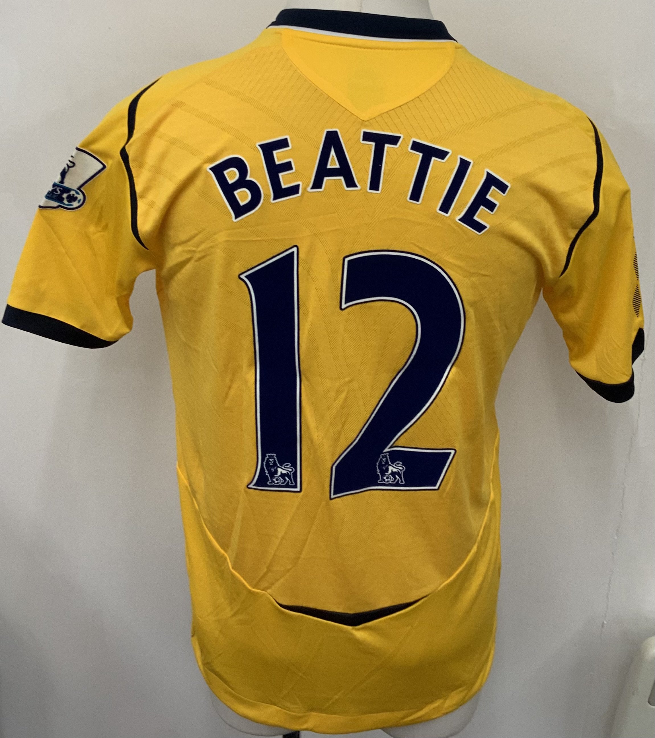 West Brom 2008 - 2009 Match Worn Football Shirt: Yellow short sleeve shirt with Premier League badging to sleeves. Beattie 12 to rear. Worn v Arsenal on 16 August 2008.