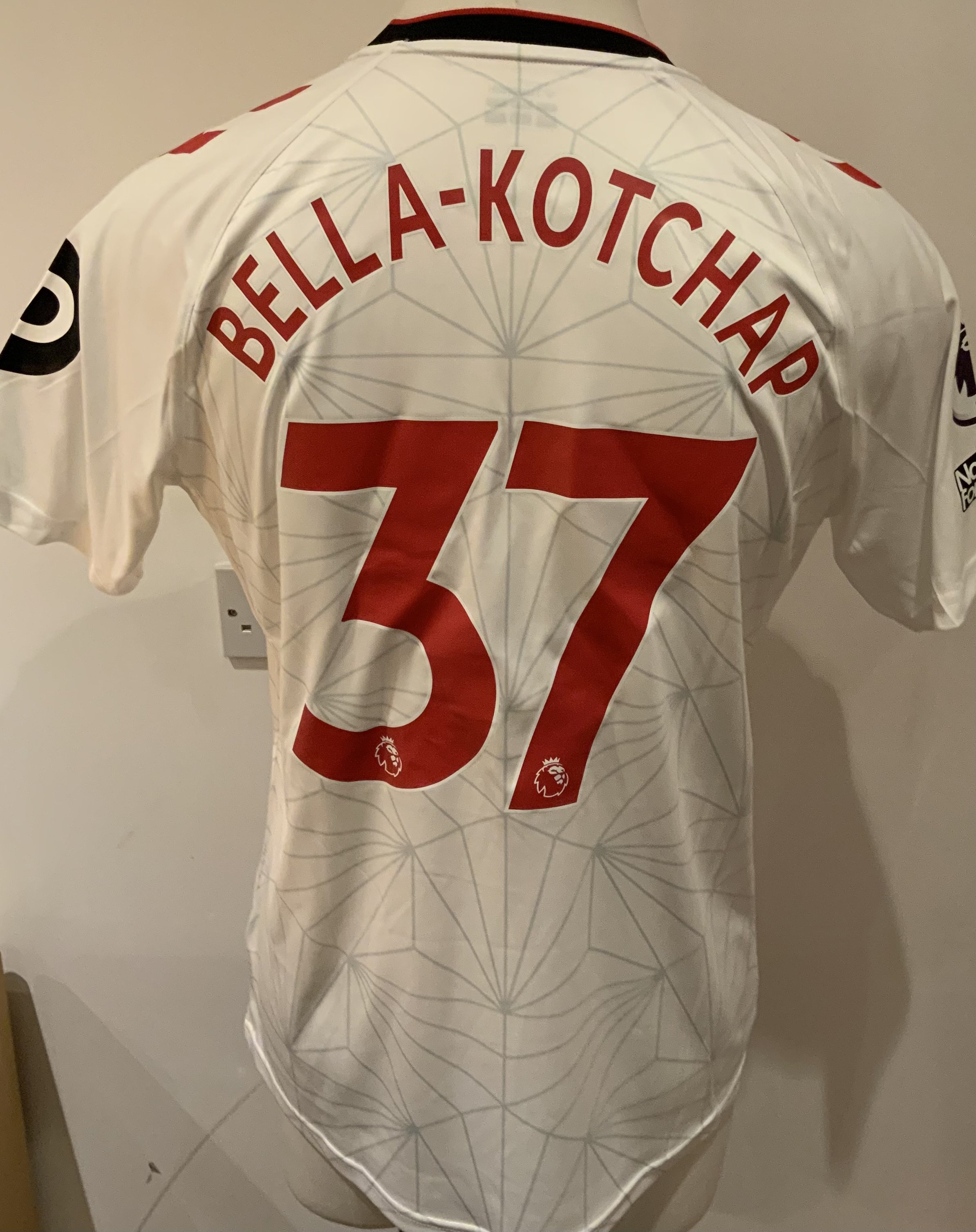 Southampton 2022 - 2023 Match Worn Football Shirt: Red and white short sleeve shirt with Premier League badge to sleeves. Bella Kotchap 37 to rear. Worn v Tottenham on 18 March 2023.