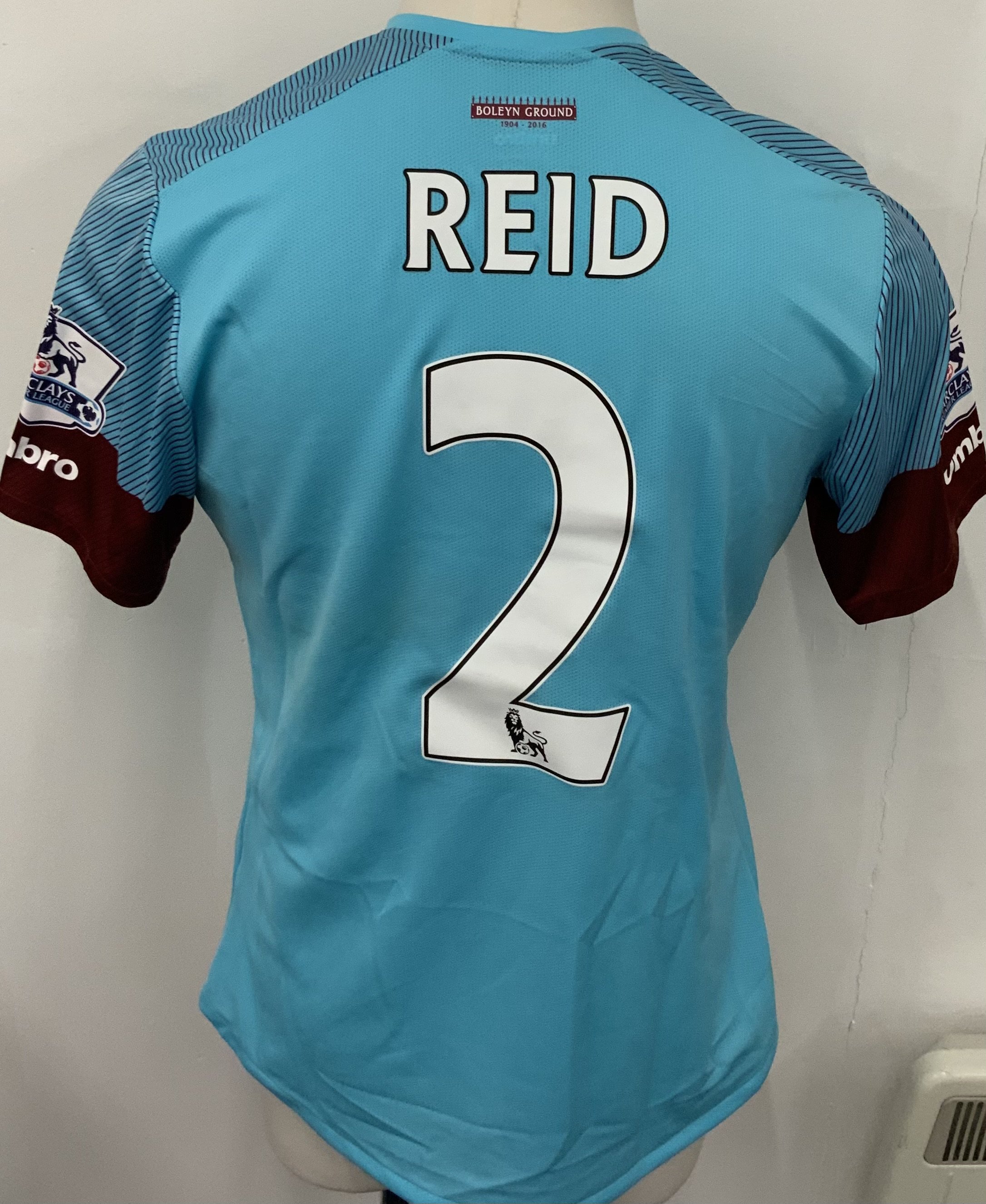 West Ham 2015 - 2016 Match Worn Football Shirt: Light blue and Claret hooped short sleeve shirt with Premier League badging to sleeves. Reid 2 to rear. Worn by the player who scored the last ever goal at Upton Park. Unwashed.