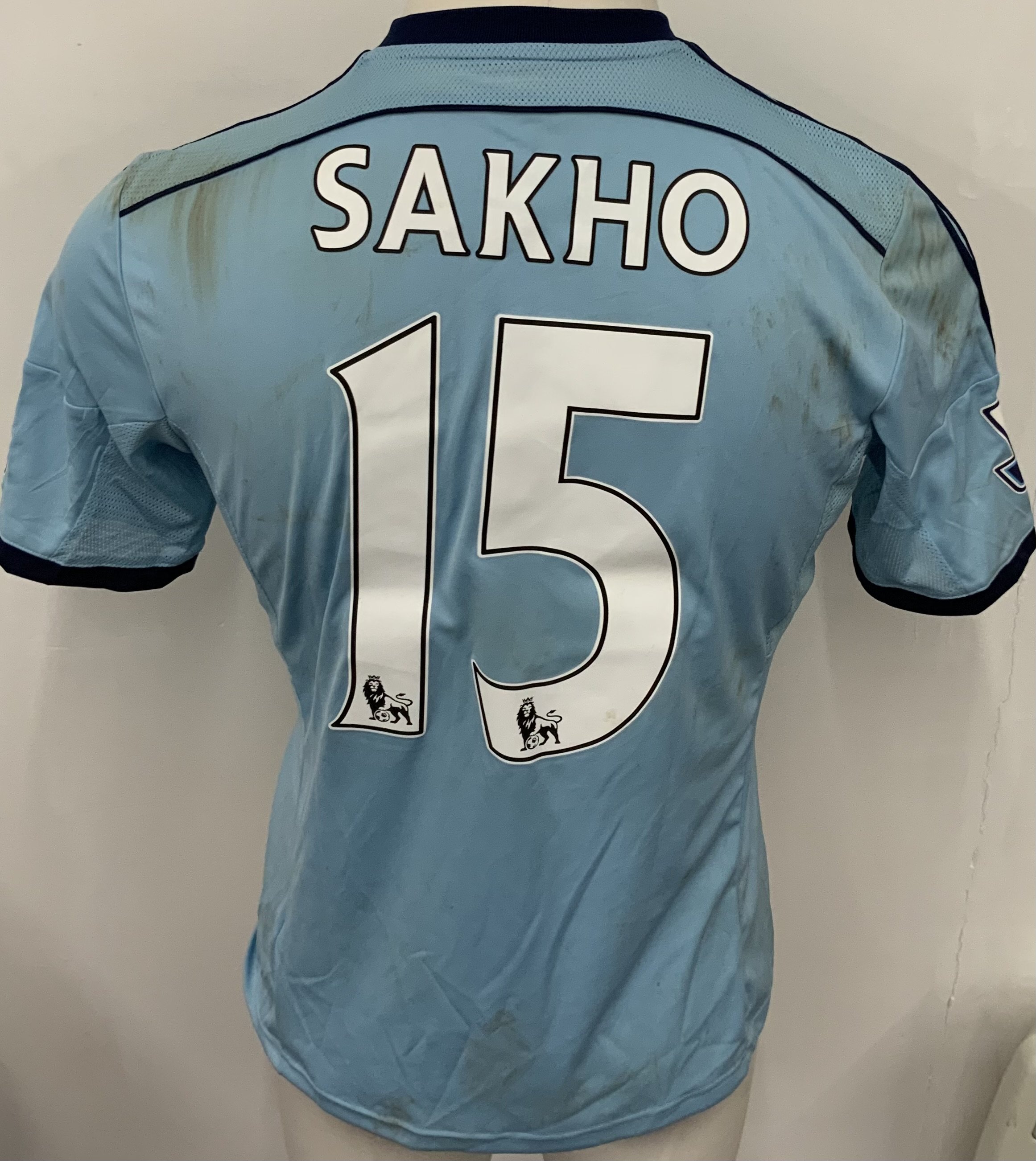 West Ham 2014 - 2015 Match Worn Football Shirt: Blue short sleeve shirt with Premier League badging to sleeves. Sakho 15 to rear. Shirt is unwashed. 