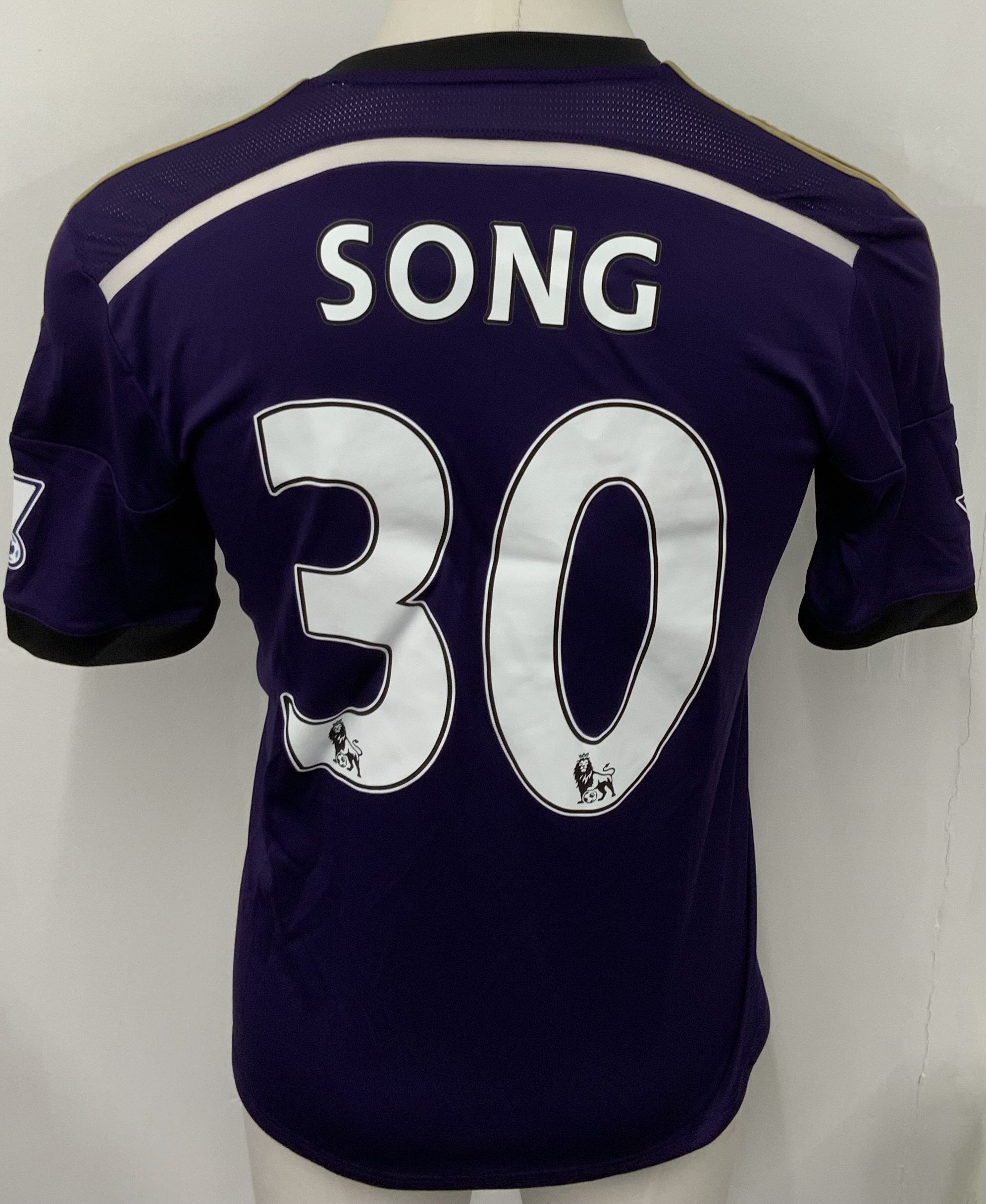West Ham 2014 - 2015 Match Worn Football Shirt: Purple short sleeve shirt with Premier League badging to sleeves. Song 30 to rear. Worn during FA Cup match v Everton on 13 January 2015. Song started the match. 