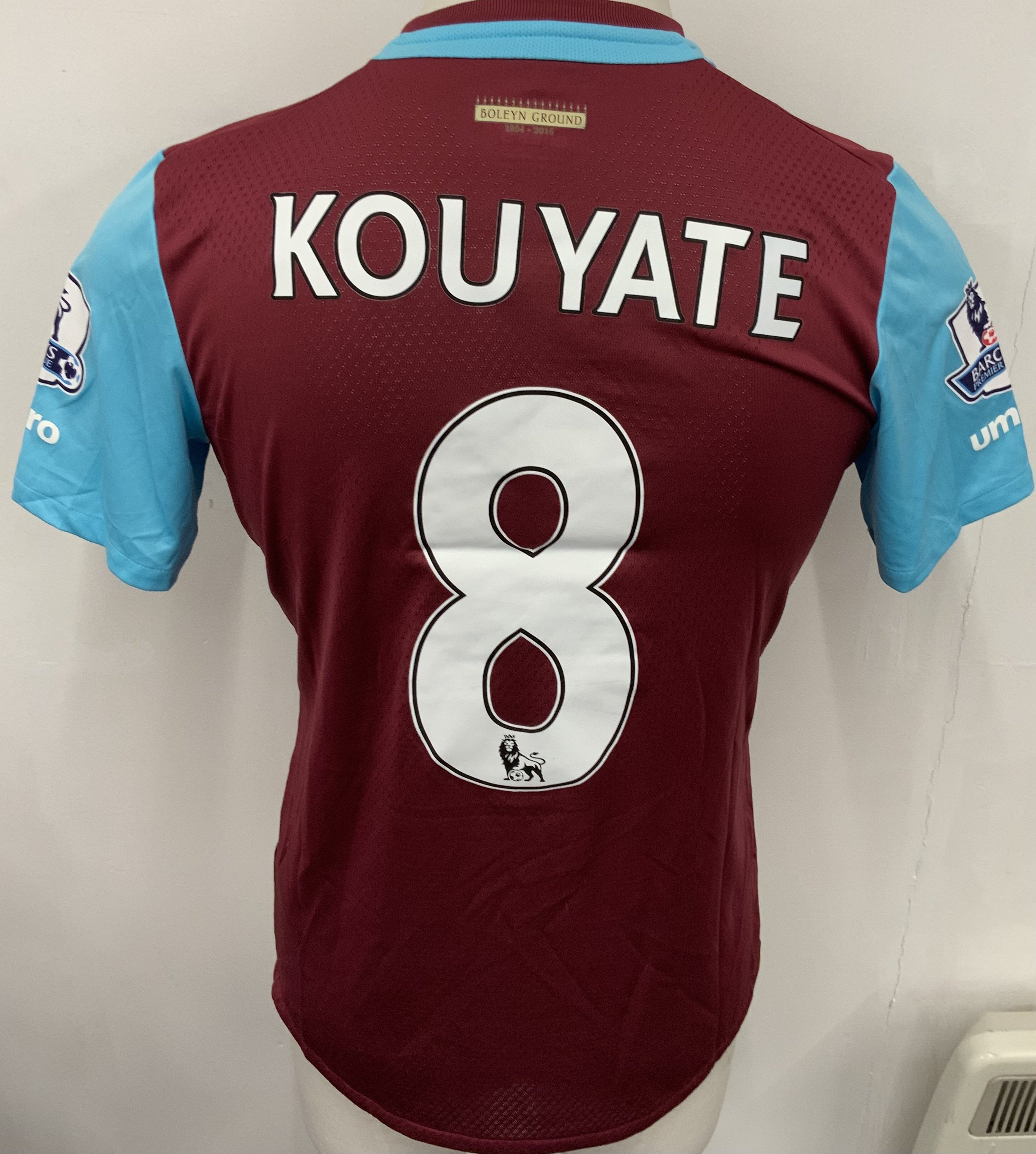 West Ham 2015 - 2016 Match Worn Football Shirt: Claret and blue short sleeve Poppy shirt with Premier League badging to sleeves. Kouyate 8 to rear. Worn v Everton on 7 November 2015.