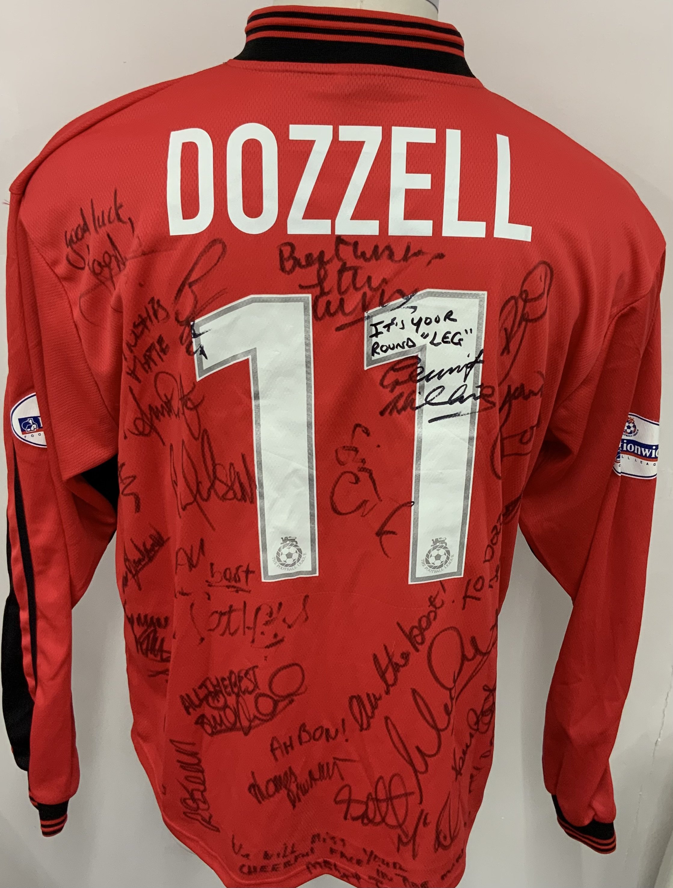 Colchester United 2001 - 2002 Match Worn Football Shirt: Red long sleeve third shirt with Nationwide League badging to sleeves. Dozzell 11 to rear. This was signed by his team mates after his final appearance for the club. 